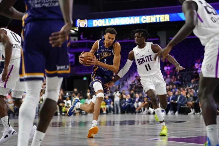 Oct 4, 2022; Henderson, NV, USA; Boulogne-Levallois Metropolitans 92 forward Victor Wembanyama (1) drives the ball against NBA G League Ignite forward Leonard Miller (11) during the third quarter at The Dollar Loan Center. Mandatory Credit: Lucas Peltier-USA TODAY Sports