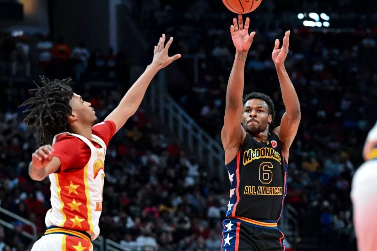 Mar 28, 2023; Houston, TX, USA; McDonald's All American West guard Bronny James (6) shoots the ball during the first half against the McDonald's All American East at Toyota Center. Mandatory Credit: Maria Lysaker-USA TODAY Sports