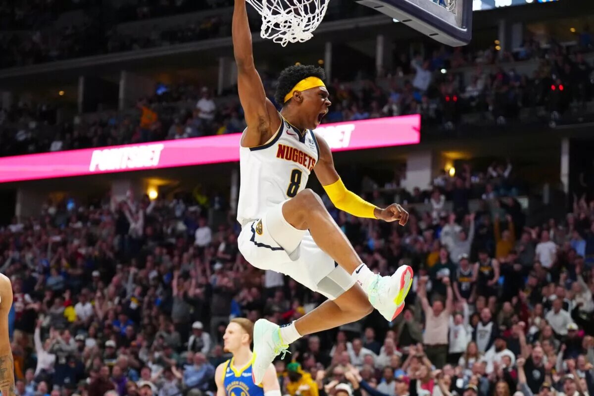 Apr 2, 2023; Denver, Colorado, USA; Denver Nuggets forward Peyton Watson (8) reacts after his dunk in the second half against the Golden State Warriors at Ball Arena. Mandatory Credit: Ron Chenoy-USA TODAY Sports