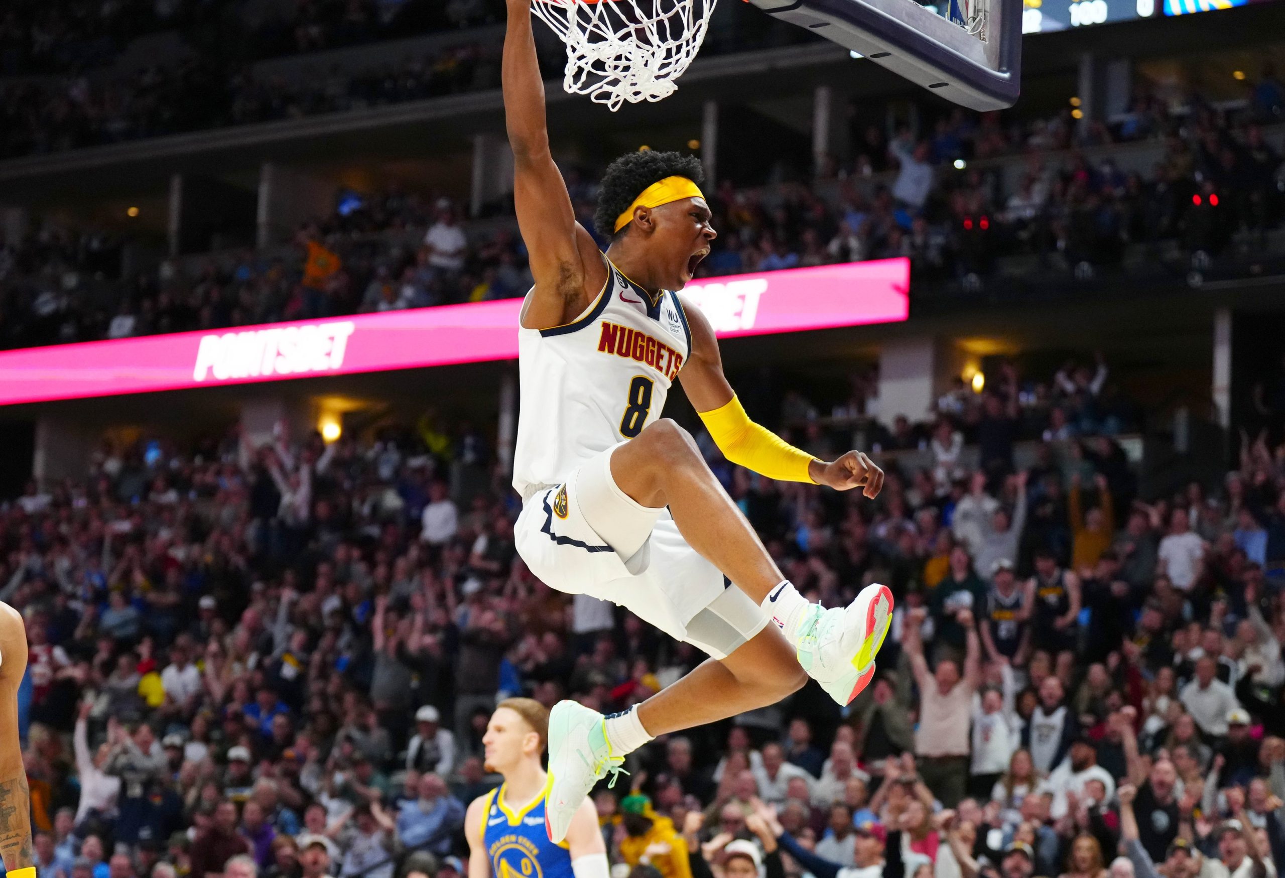 Apr 2, 2023; Denver, Colorado, USA; Denver Nuggets forward Peyton Watson (8) reacts after his dunk in the second half against the Golden State Warriors at Ball Arena. Mandatory Credit: Ron Chenoy-USA TODAY Sports