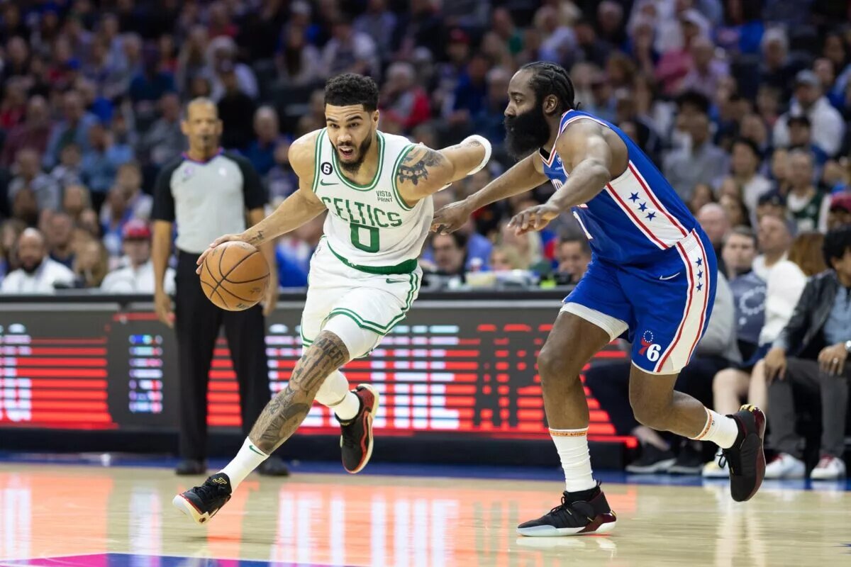 Apr 4, 2023; Philadelphia, Pennsylvania, USA; Boston Celtics forward Jayson Tatum (0) dribbles the ball against Philadelphia 76ers guard James Harden (1) during the first quarter at Wells Fargo Center. Mandatory Credit: Bill Streicher-USA TODAY Sports