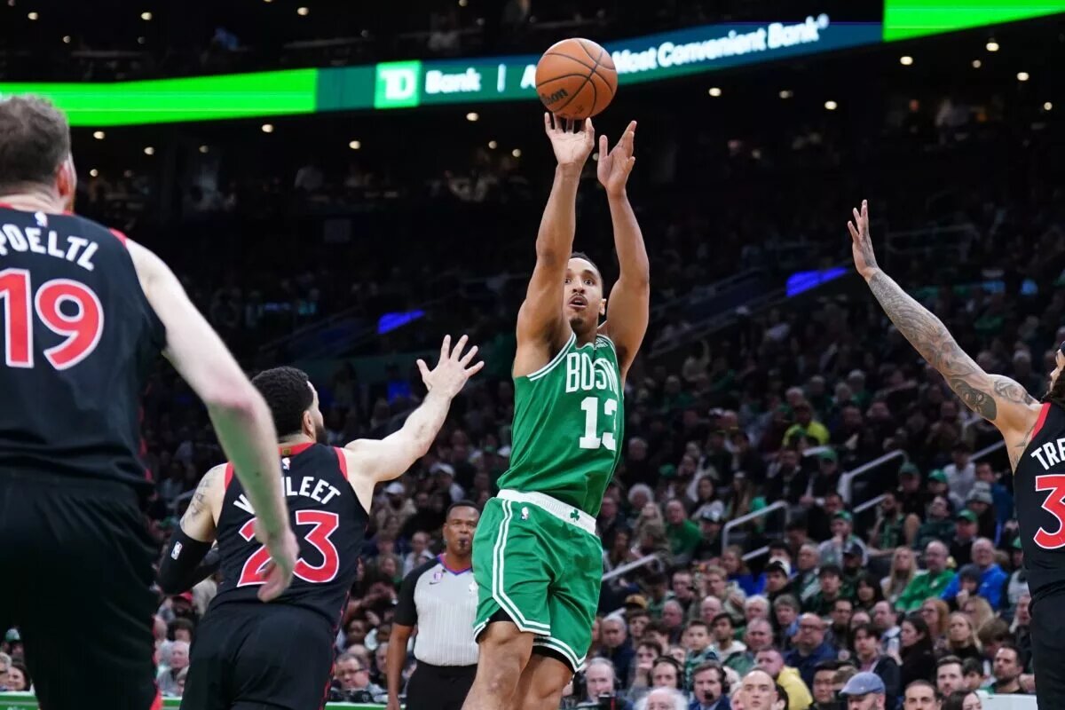 Apr 5, 2023; Boston, Massachusetts, USA; Boston Celtics guard Malcolm Brogdon (13) shoots the ball against Toronto Raptors guard Fred VanVleet (23) in the second half at TD Garden. Mandatory Credit: David Butler II-USA TODAY Sports