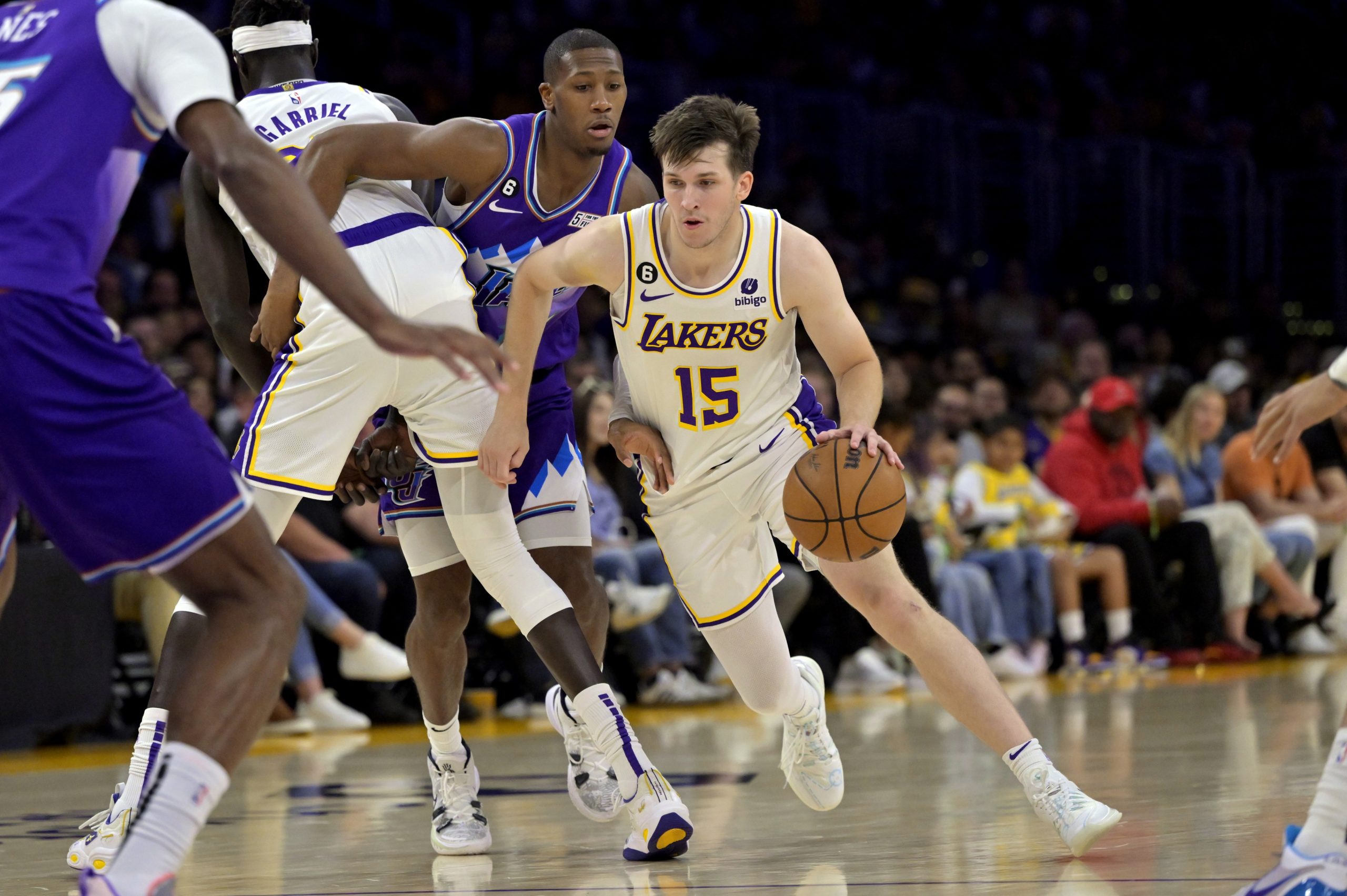 Los Angeles Lakers guard Austin Reaves (15) dribbles down the