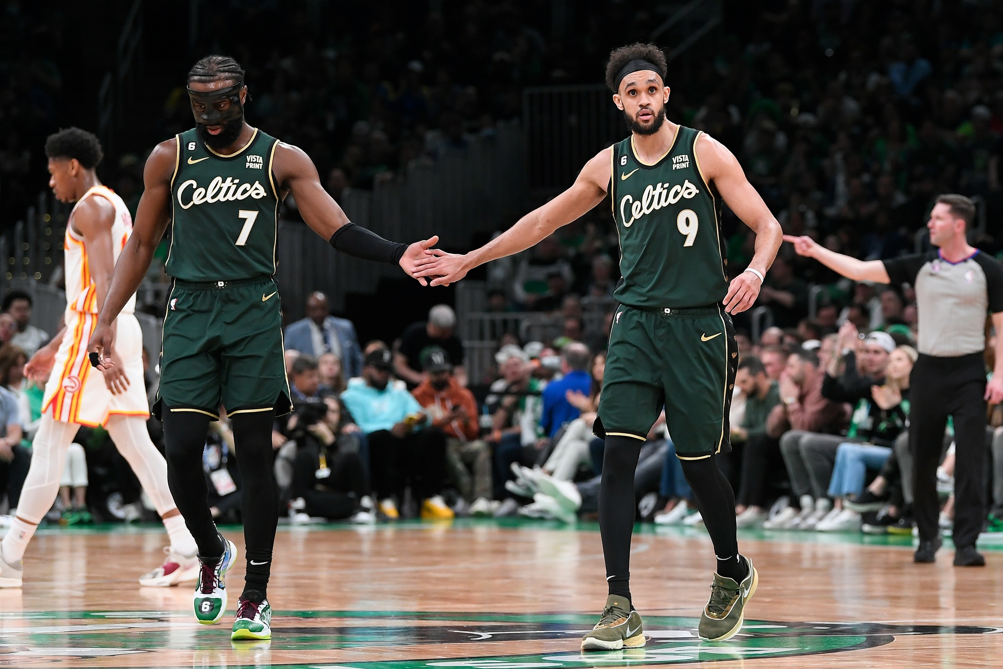 Apr 15, 2023; Boston, Massachusetts, USA; Boston Celtics guard Jaylen Brown (7) and guard Derrick White (9) react during the third quarter of game one of the 2023 NBA playoffs against the Atlanta Hawks at TD Garden. Mandatory Credit: Eric Canha-USA TODAY Sports