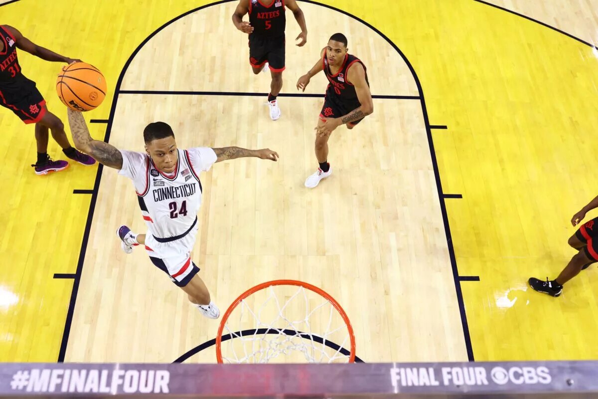 Apr 3, 2023; Houston, TX, USA; Connecticut Huskies guard Jordan Hawkins (24) dunks the ball against the San Diego State Aztecs in the national championship game of the 2023 NCAA Tournamemt at NRG Stadium. Will he be a member of the Los Angeles Lakers? Mandatory Credit: NCAA Basketball: Brett Wilhelm/Pool Photo-USA TODAY Sports