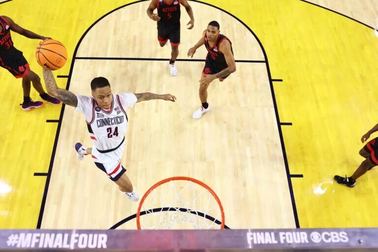 Apr 3, 2023; Houston, TX, USA; Connecticut Huskies guard Jordan Hawkins (24) dunks the ball against the San Diego State Aztecs in the national championship game of the 2023 NCAA Tournamemt at NRG Stadium. Will he be a member of the Los Angeles Lakers? Mandatory Credit: NCAA Basketball: Brett Wilhelm/Pool Photo-USA TODAY Sports