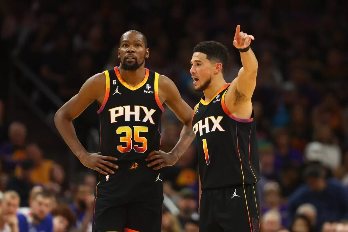 Apr 18, 2023; Phoenix, Arizona, USA; Phoenix Suns guard Devin Booker (1) with forward Kevin Durant (35) against the Los Angeles Clippers in the second half during game two of the 2023 NBA playoffs at Footprint Center. Mandatory Credit: Mark J. Rebilas-USA TODAY Sports