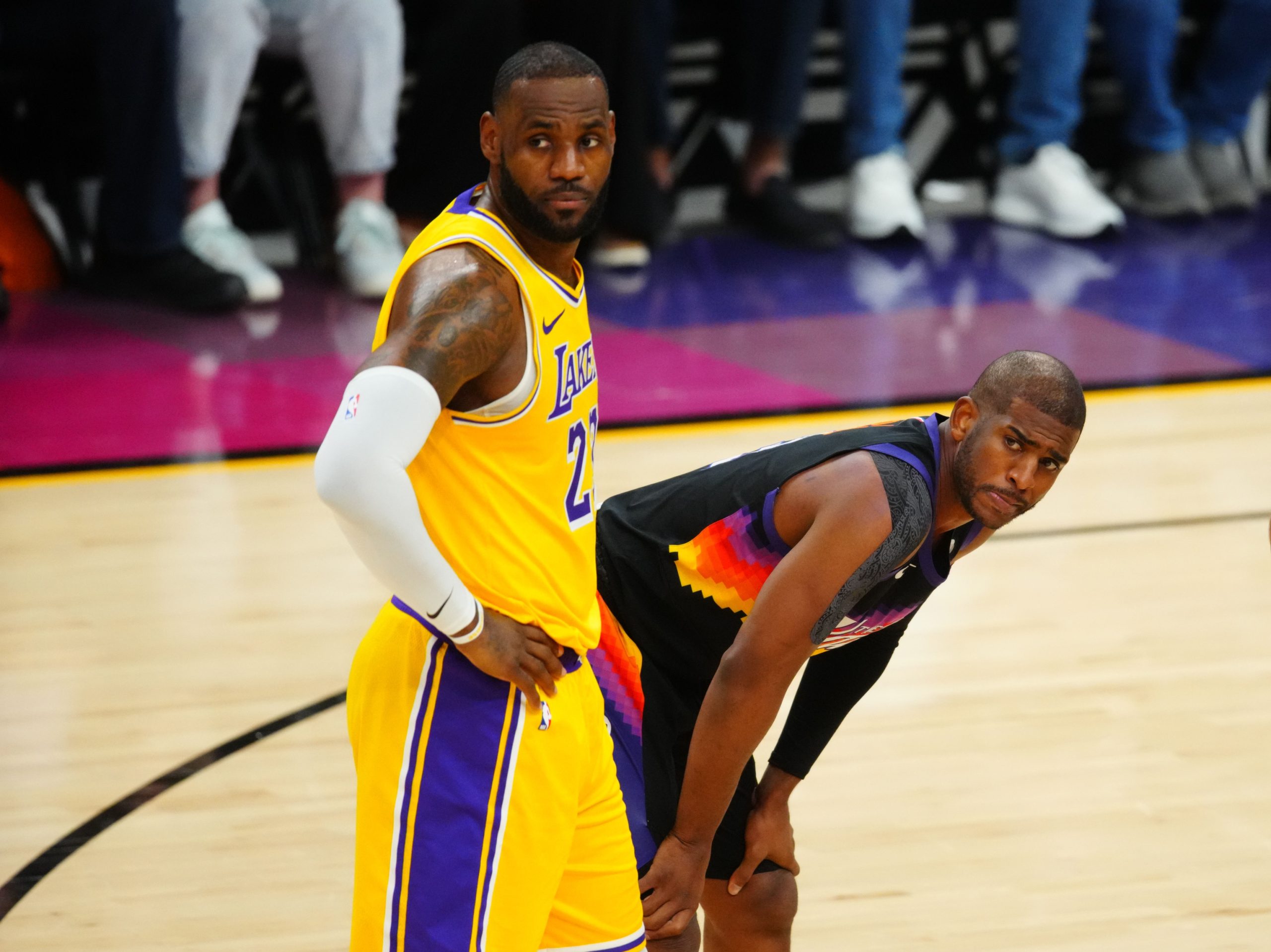 May 25, 2021; Phoenix, Arizona, USA; Los Angeles Lakers forward LeBron James (left) alongside Phoenix Suns guard Chris Paul during the second half in game two of the first round of the 2021 NBA Playoffs at Phoenix Suns Arena. Mandatory Credit: Mark J. Rebilas-USA TODAY Sports