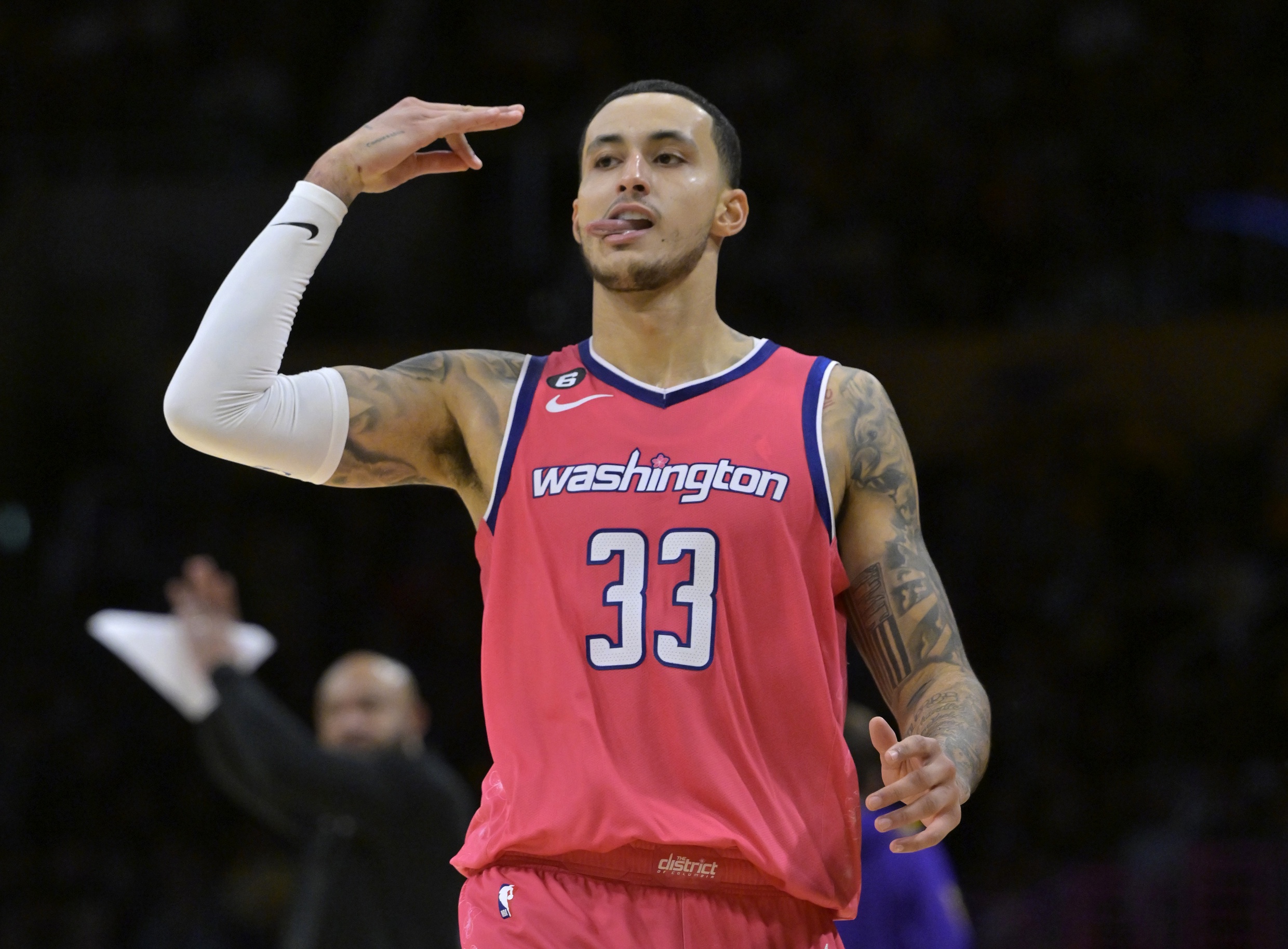 Dec 18, 2022; Los Angeles, California, USA; Washington Wizards forward Kyle Kuzma (33) signals after a 3 point basket in the second half against the Los Angeles Lakers at Crypto.com Arena. Mandatory Credit: Jayne Kamin-Oncea-USA TODAY Sports