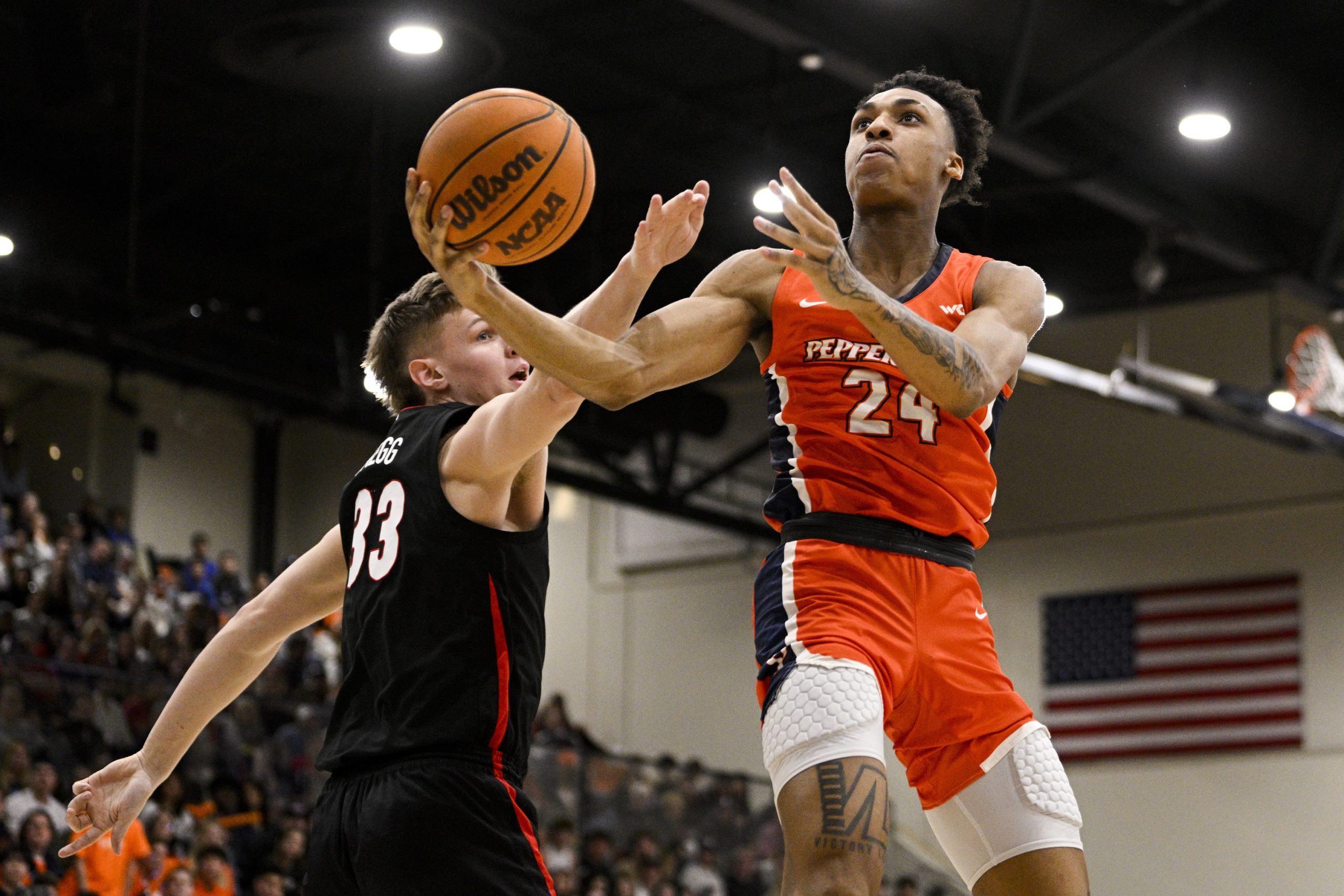 Feb 18, 2023; Malibu, California, USA; Pepperdine Waves forward Maxwell Lewis (24) goes up for a basket against Gonzaga Bulldogs guard Malachi Smith (13) during the first half at Firestone Fieldhouse. Mandatory Credit: Kelvin Kuo-USA TODAY Sports