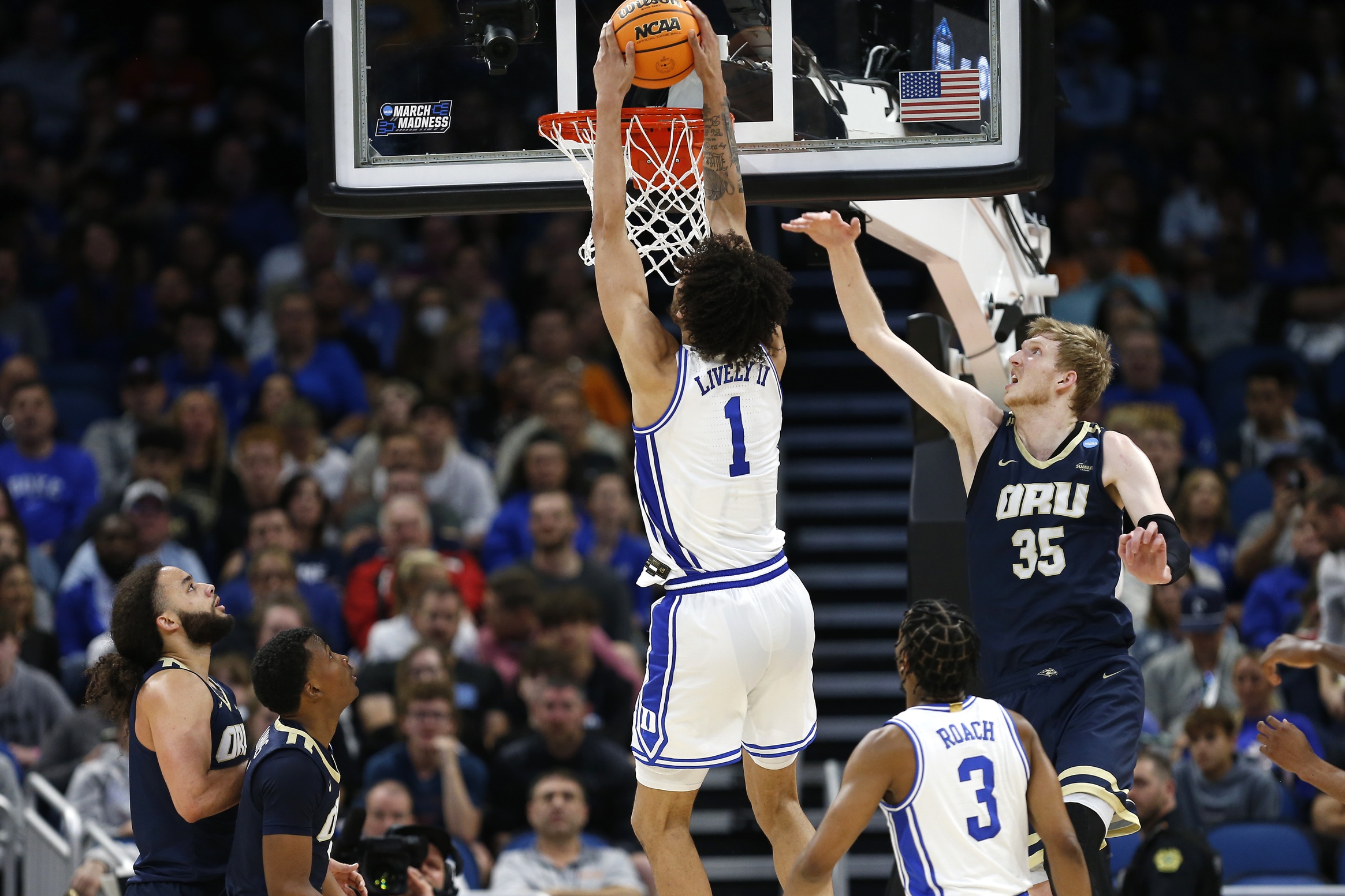 Mar 16, 2023; Orlando, FL, USA; Duke Blue Devils center Dereck Lively II (1) dunks the ball past Oral Roberts Golden Eagles forward Connor Vanover (35) during the first half at Amway Center. Mandatory Credit: Russell Lansford-USA TODAY Sports