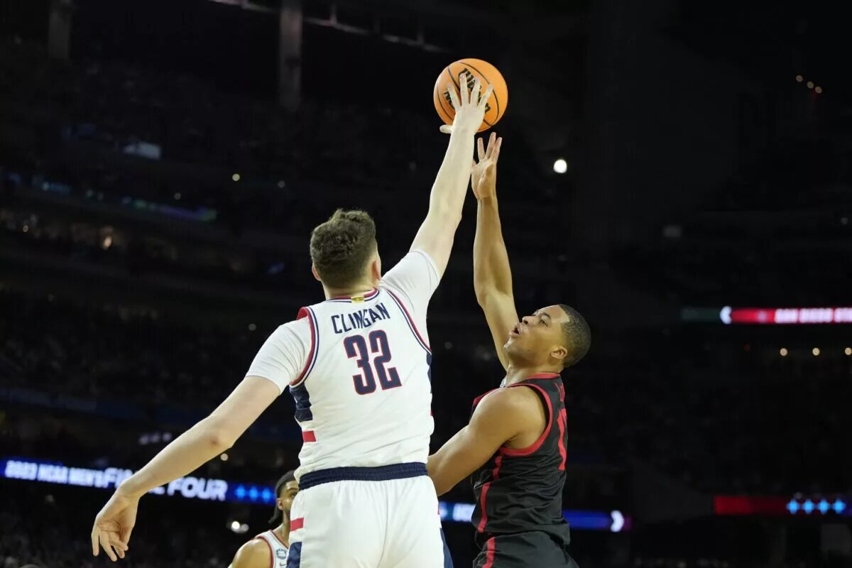 Apr 3, 2023; Houston, TX, USA; Connecticut Huskies center Donovan Clingan (32) blocks the shot of San Diego State Aztecs forward Jaedon LeDee (13) during the second half in the national championship game of the 2023 NCAA Tournament at NRG Stadium. Mandatory Credit: Bob Donnan-USA TODAY Sports