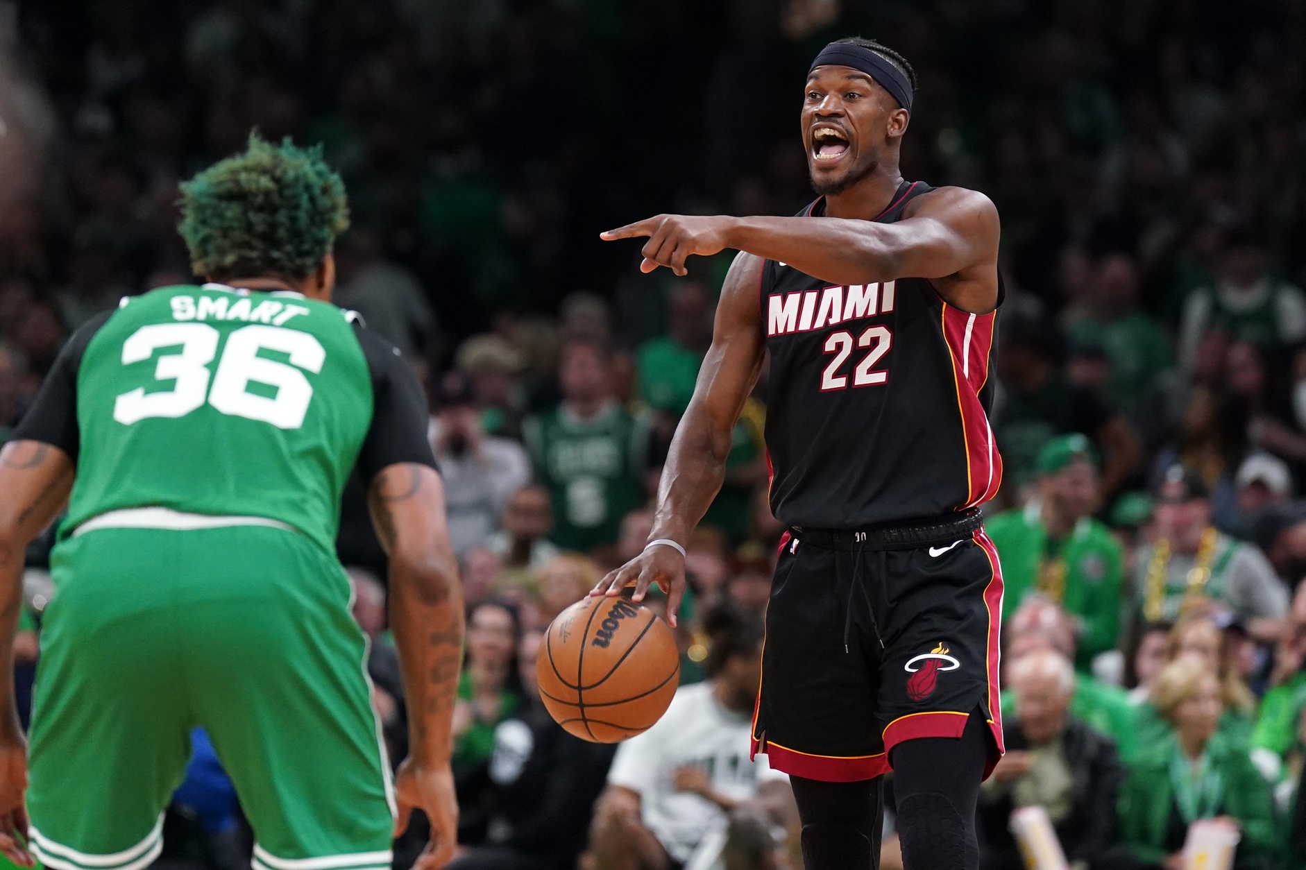 May 29, 2023; Boston, Massachusetts, USA; Miami Heat forward Jimmy Butler (22) controls the ball against Boston Celtics guard Marcus Smart (36) in the first quarter during game seven of the Eastern Conference Finals for the 2023 NBA playoffs at TD Garden. Mandatory Credit: David Butler II-USA TODAY Sports