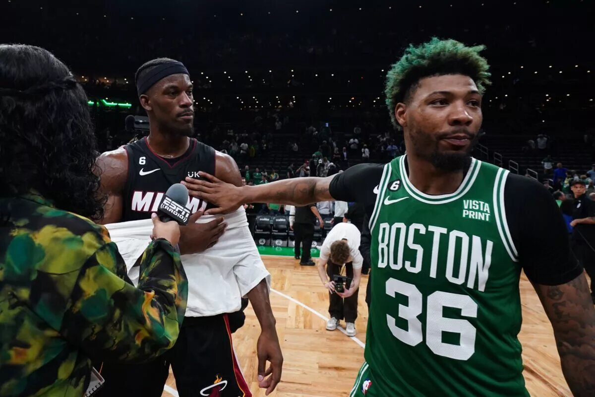 May 29, 2023; Boston, Massachusetts, USA; Miami Heat forward Jimmy Butler (22) embraces Boston Celtics guard Marcus Smart (36) after the Heat defeated the Celtics in game seven of the Eastern Conference Finals for the 2023 NBA playoffs at TD Garden. Mandatory Credit: David Butler II-USA TODAY Sports