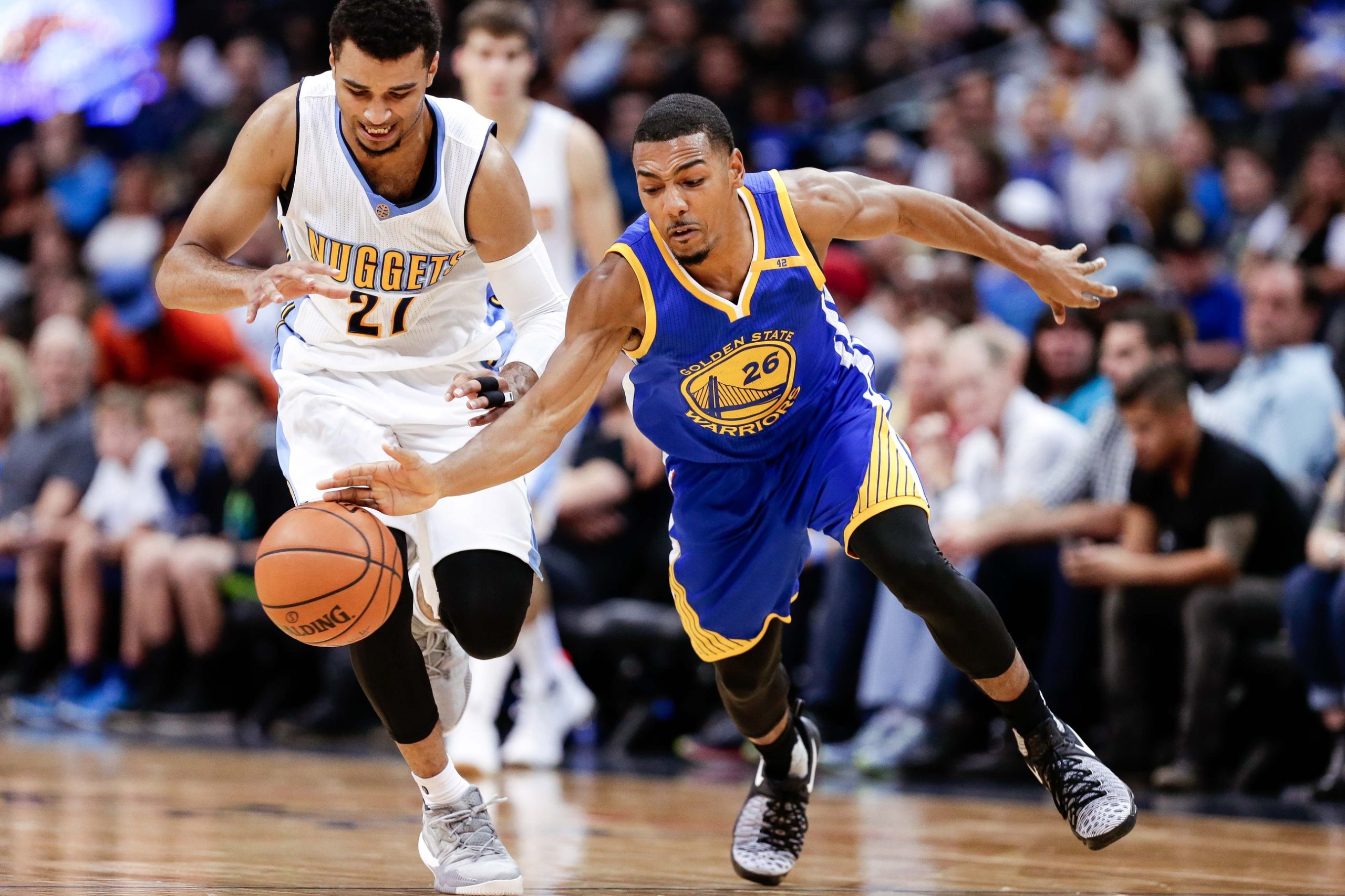 Oct 14, 2016; Denver, CO, USA; New Celtics assistant coach and former Golden State Warriors guard Phil Pressey (26) and Denver Nuggets guard Jamal Murray (27) battle for the ball in overtime at the Pepsi Center. The Warriors won 129-128. Mandatory Credit: Isaiah J. Downing-USA TODAY Sports