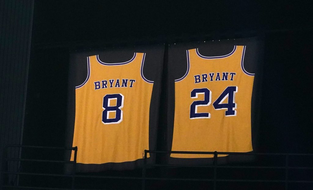 Former Laker Kobe Bryant looks on during his jersey retirement