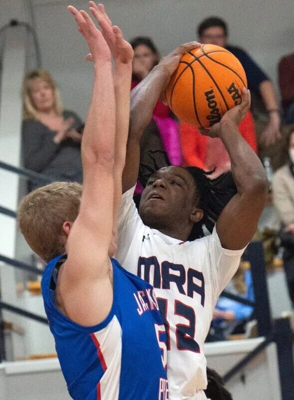 Madison-Ridgeland Academy's Josh Hubbard goes up for a shot over Prep's Luke Segrest during play at MRA in Madison, Miss., Tuesday, Jan. 11, 2022. Tcl Mra Prep 25