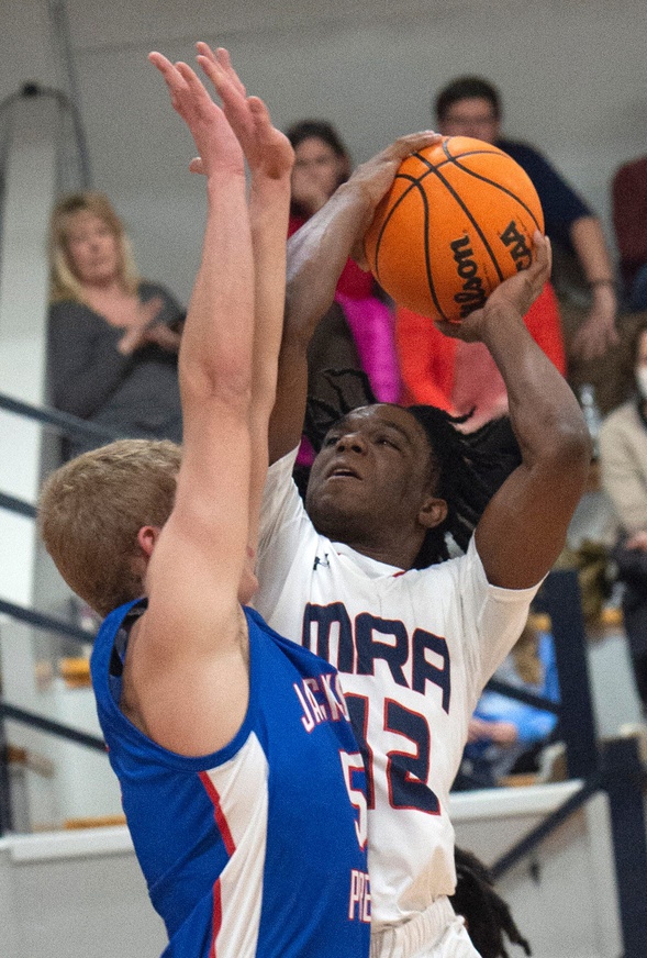 Madison-Ridgeland Academy's Josh Hubbard goes up for a shot over Prep's Luke Segrest during play at MRA in Madison, Miss., Tuesday, Jan. 11, 2022. Tcl Mra Prep 25