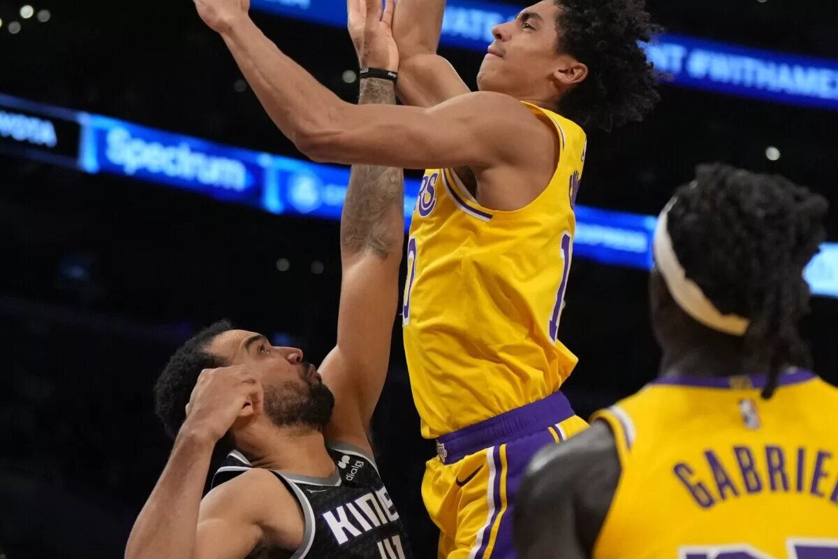 Jan 18, 2023; Los Angeles, California, USA; Los Angeles Lakers guard Max Christie (10) shoots the ball against Sacramento Kings forward Trey Lyles (41) in the second hafl at Crypto.com Arena. Mandatory Credit: Kirby Lee-USA TODAY Sports