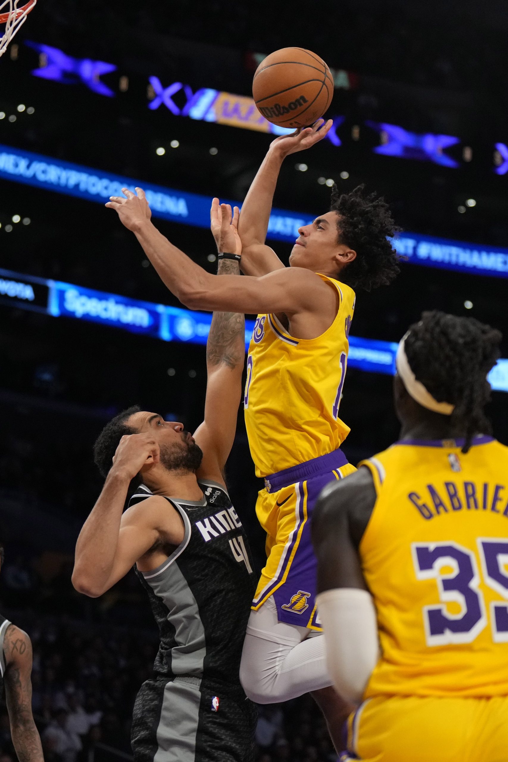 Jan 18, 2023; Los Angeles, California, USA; Los Angeles Lakers guard Max Christie (10) shoots the ball against Sacramento Kings forward Trey Lyles (41) in the second hafl at Crypto.com Arena. Mandatory Credit: Kirby Lee-USA TODAY Sports