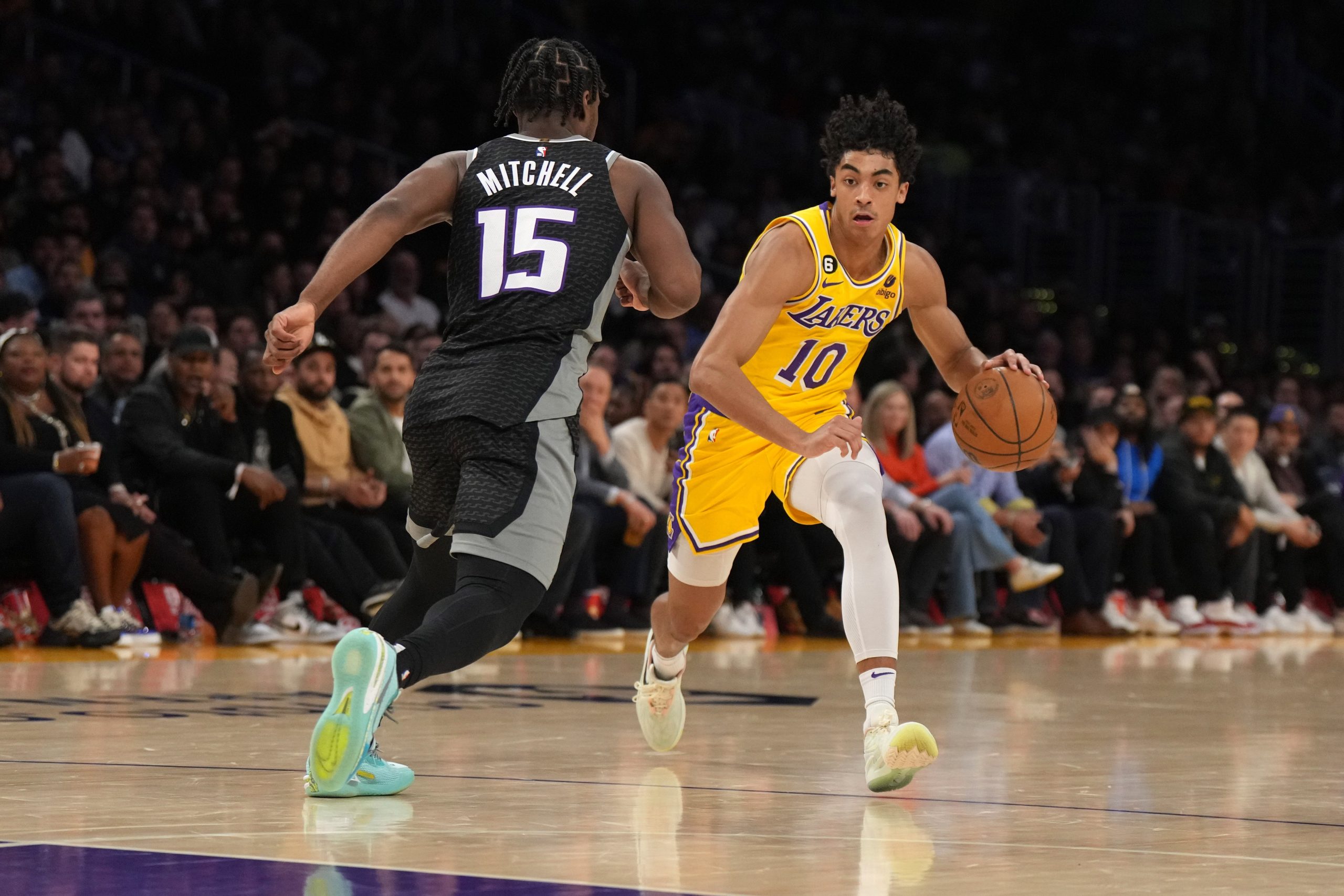 Jan 18, 2023; Los Angeles, California, USA;Los Angeles Lakers guard Max Christie (10) dribbles the ball against Sacramento Kings guard Davion Mitchell (15) in the second half at Crypto.com Arena. Mandatory Credit: Kirby Lee-USA TODAY Sports