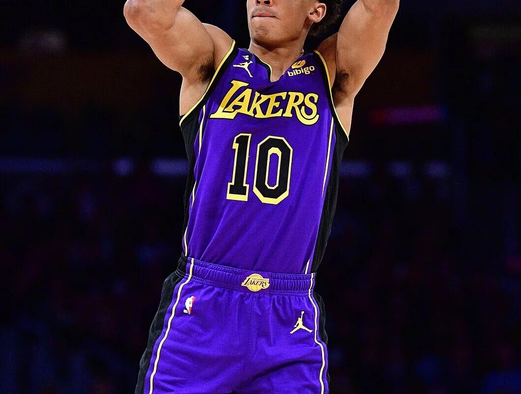 January 20, 2023; Los Angeles, California, USA; Los Angeles Lakers guard Max Christie (10) shoots three point basket against the Memphis Grizzlies during the first half at Crypto.com Arena. Mandatory Credit: Gary A. Vasquez-USA TODAY Sports