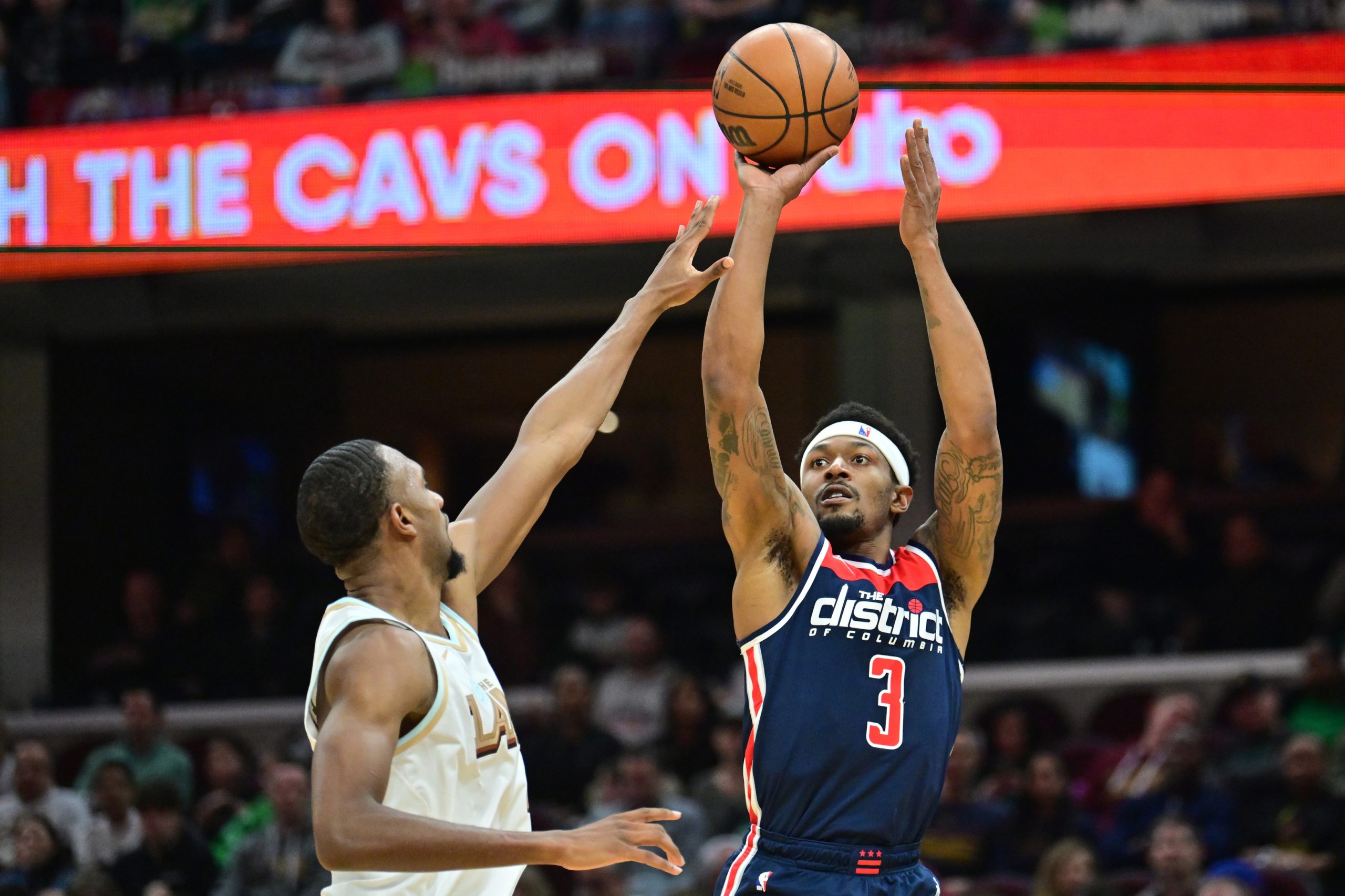 Mar 17, 2023; Cleveland, Ohio, USA; Washington Wizards guard Bradley Beal (3) shoots over the defense of Cleveland Cavaliers forward Evan Mobley (4) during the second half at Rocket Mortgage FieldHouse. Mandatory Credit: Ken Blaze-USA TODAY Sports