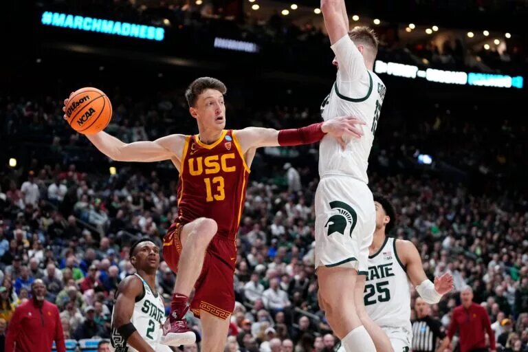 Mar 17, 2023; Columbus, Ohio, USA; USC Trojans guard Drew Peterson (13) passes around Michigan State Spartans center Carson Cooper (15) during the first round of the NCAA men’s basketball tournament at Nationwide Arena. Will Peterson sign with the Miami Heat? Mandatory Credit: Adam Cairns-The Columbus Dispatch Basketball Ncaa Men S Basketball Tournament