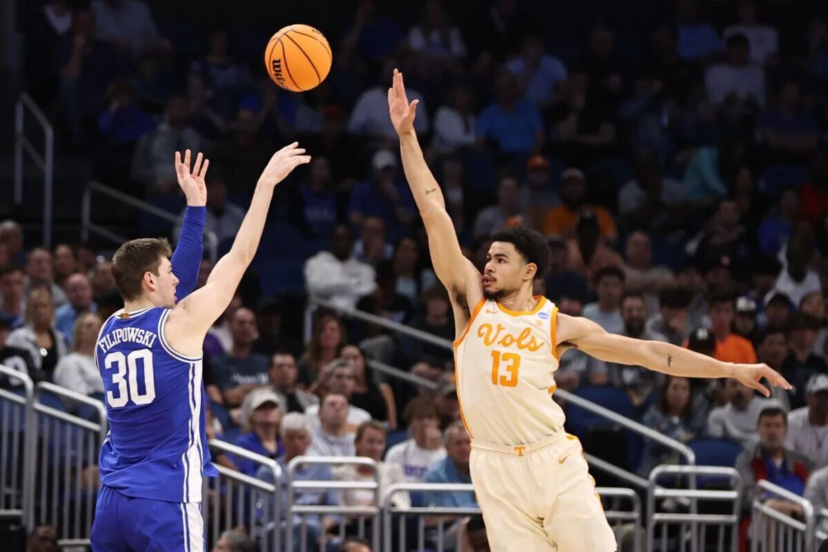 Mar 18, 2023; Orlando, FL, USA; Duke Blue Devils center Kyle Filipowski (30) shoots over Tennessee Volunteers forward Olivier Nkamhoua (13) during the second half in the second round of the 2023 NCAA Tournament at Legacy Arena. Mandatory Credit: Matt Pendleton-USA TODAY Sports