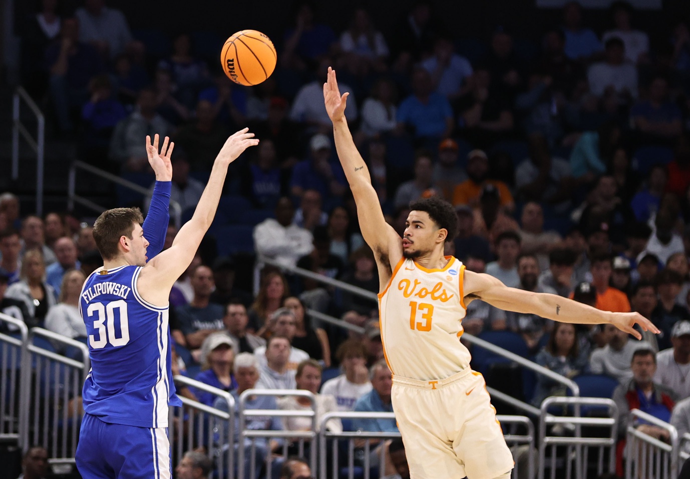 Mar 18, 2023; Orlando, FL, USA; Duke Blue Devils center Kyle Filipowski (30) shoots over Tennessee Volunteers forward Olivier Nkamhoua (13) during the second half in the second round of the 2023 NCAA Tournament at Legacy Arena. Mandatory Credit: Matt Pendleton-USA TODAY Sports