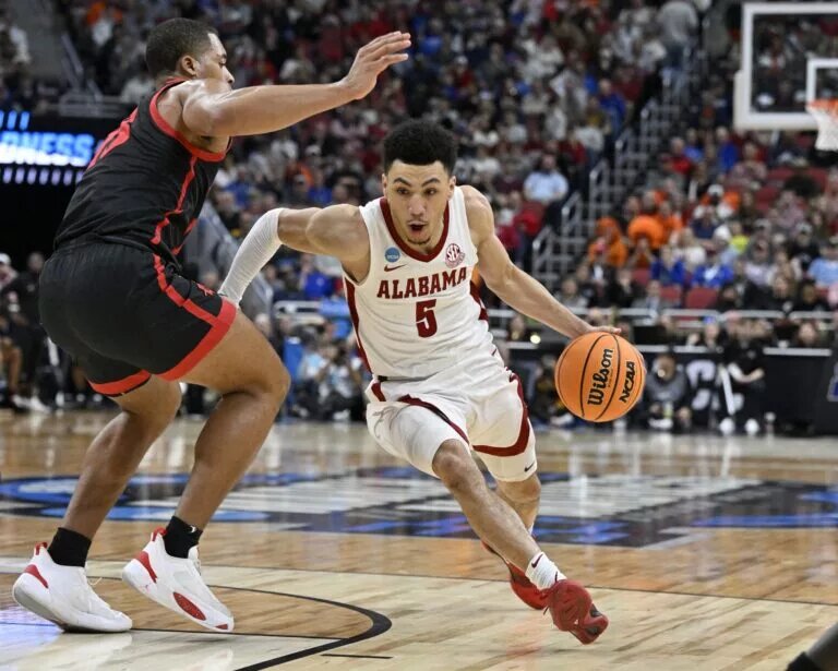 Mar 24, 2023; Louisville, KY, USA; Alabama Crimson Tide guard Jahvon Quinerly (5) drives against San Diego State Aztecs forward Jaedon LeDee (13) during the second half of the NCAA tournament round of sixteen at KFC YUM! Center. Mandatory Credit: Jamie Rhodes-USA TODAY Sports