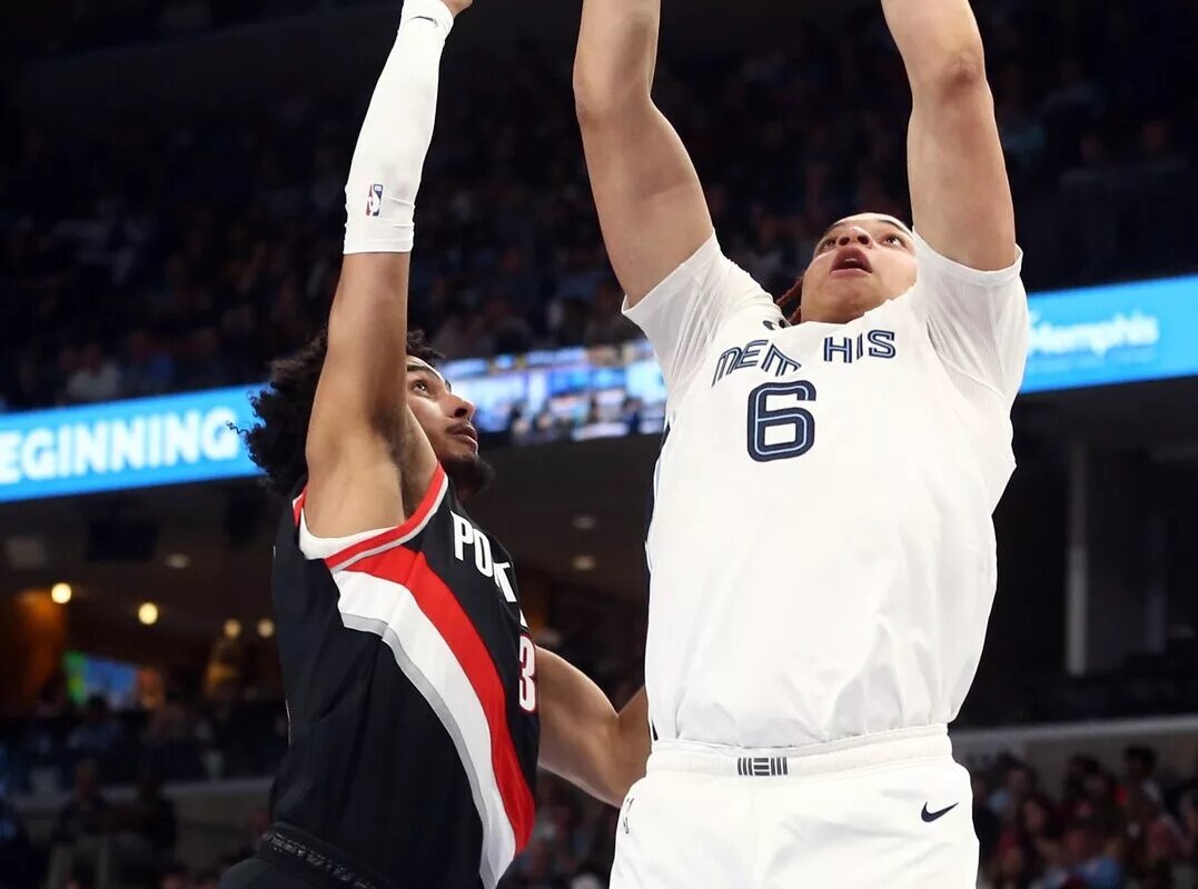 Apr 4, 2023; Memphis, Tennessee, USA; Memphis Grizzlies forward Kenneth Lofton Jr. (6) shoots as Portland Trail Blazers forward Justin Minaya (35) defends during the second half at FedExForum. Mandatory Credit: Petre Thomas-USA TODAY Sports