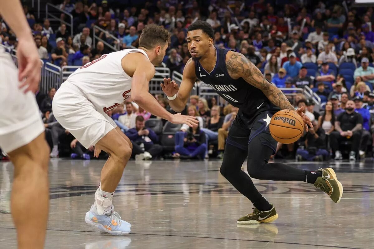 Apr 6, 2023; Orlando, Florida, USA; Orlando Magic guard Jay Scrubb (0) moves to the basket against Cleveland Cavaliers guard Raul Neto (19) during the second half at Amway Center. Mandatory Credit: Mike Watters-USA TODAY Sports
