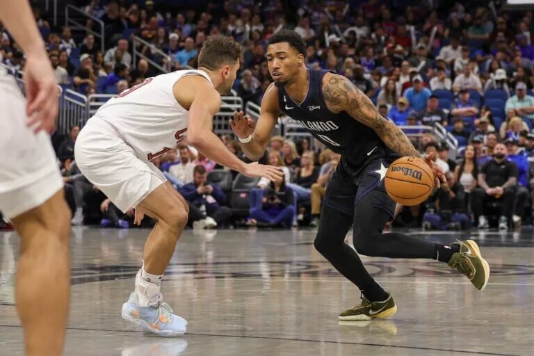 Apr 6, 2023; Orlando, Florida, USA; Orlando Magic guard Jay Scrubb (0) moves to the basket against Cleveland Cavaliers guard Raul Neto (19) during the second half at Amway Center. Mandatory Credit: Mike Watters-USA TODAY Sports
