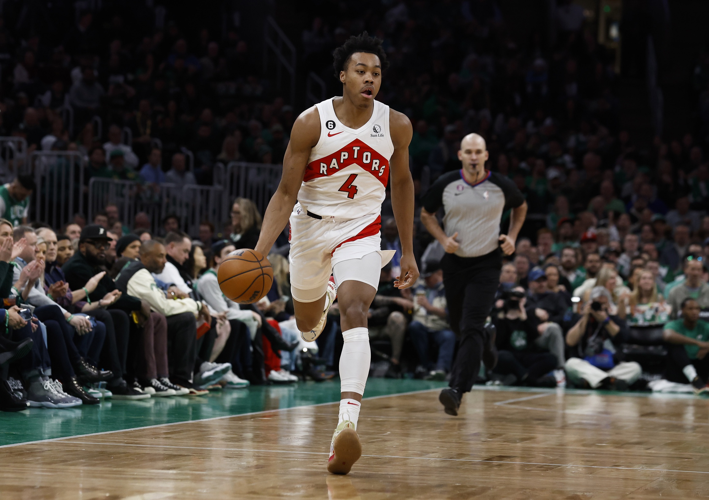 Apr 7, 2023; Boston, Massachusetts, USA; Toronto Raptors forward Scottie Barnes (4) brings the ball up the court against the Boston Celtics during the first quarter at TD Garden. Mandatory Credit: Winslow Townson-USA TODAY Sports