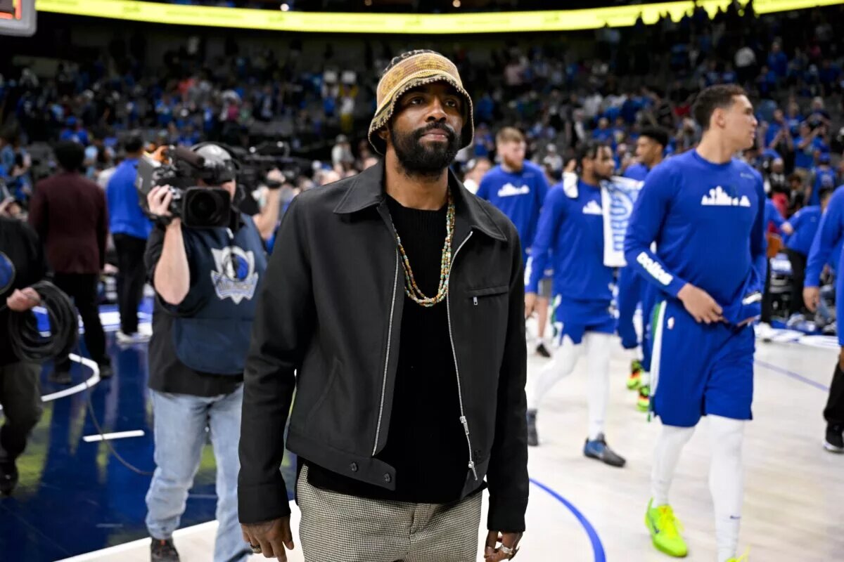 Apr 9, 2023; Dallas, Texas, USA; Dallas Mavericks guard Kyrie Irving (2) walks off the court after the loss to the San Antonio Spurs at the American Airlines Center. Mandatory Credit: Jerome Miron-USA TODAY Sports