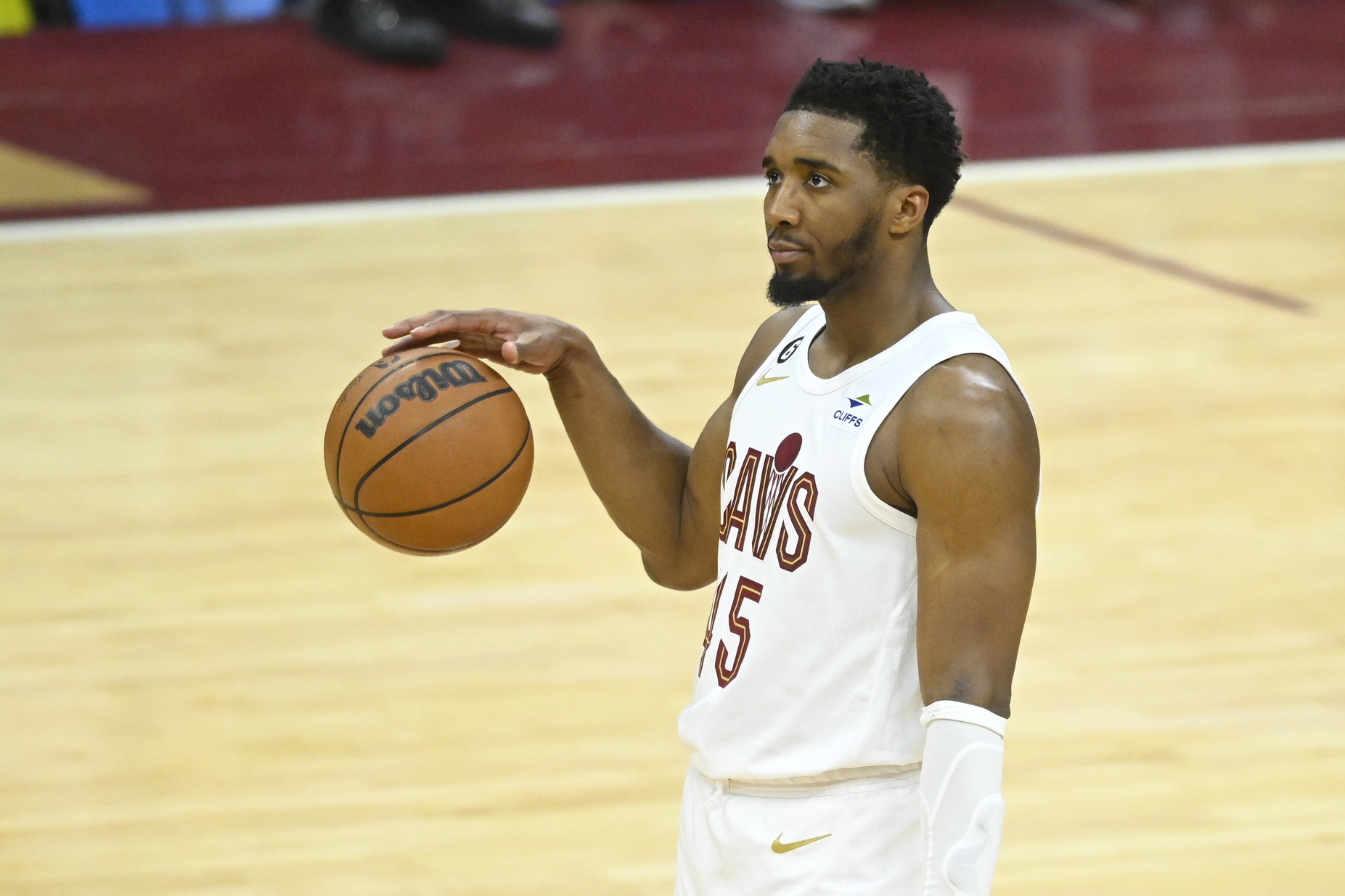 Apr 26, 2023; Cleveland, Ohio, USA; Cleveland Cavaliers guard Donovan Mitchell (45) dribbles out the clock in the fourth quarter during game five of the 2023 NBA playoffs against the New York Knicks at Rocket Mortgage FieldHouse. Mandatory Credit: David Richard-USA TODAY Sports