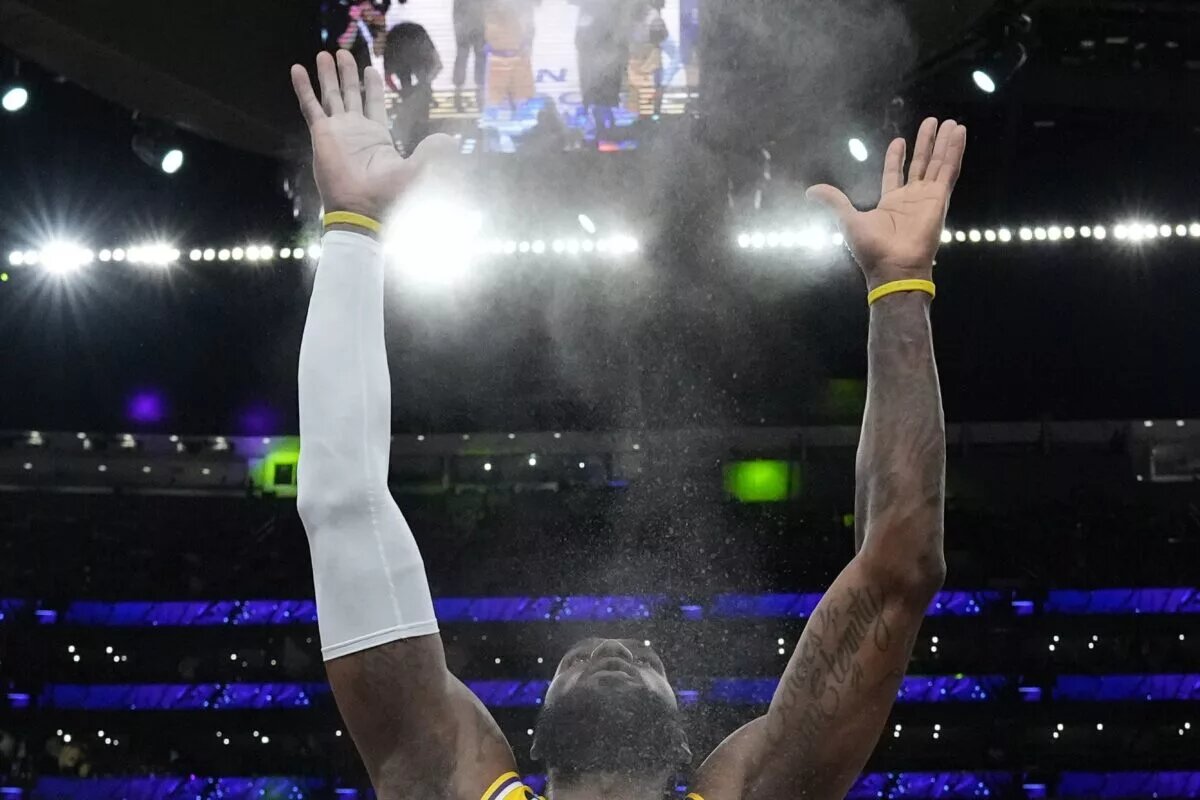 May 8, 2023; Los Angeles, California, USA; Los Angeles Lakers forward LeBron James (6) throws powdered chalk into the air during game four of the 2023 NBA playoffs at Crypto.com Arena. Mandatory Credit: Kirby Lee-USA TODAY Sports