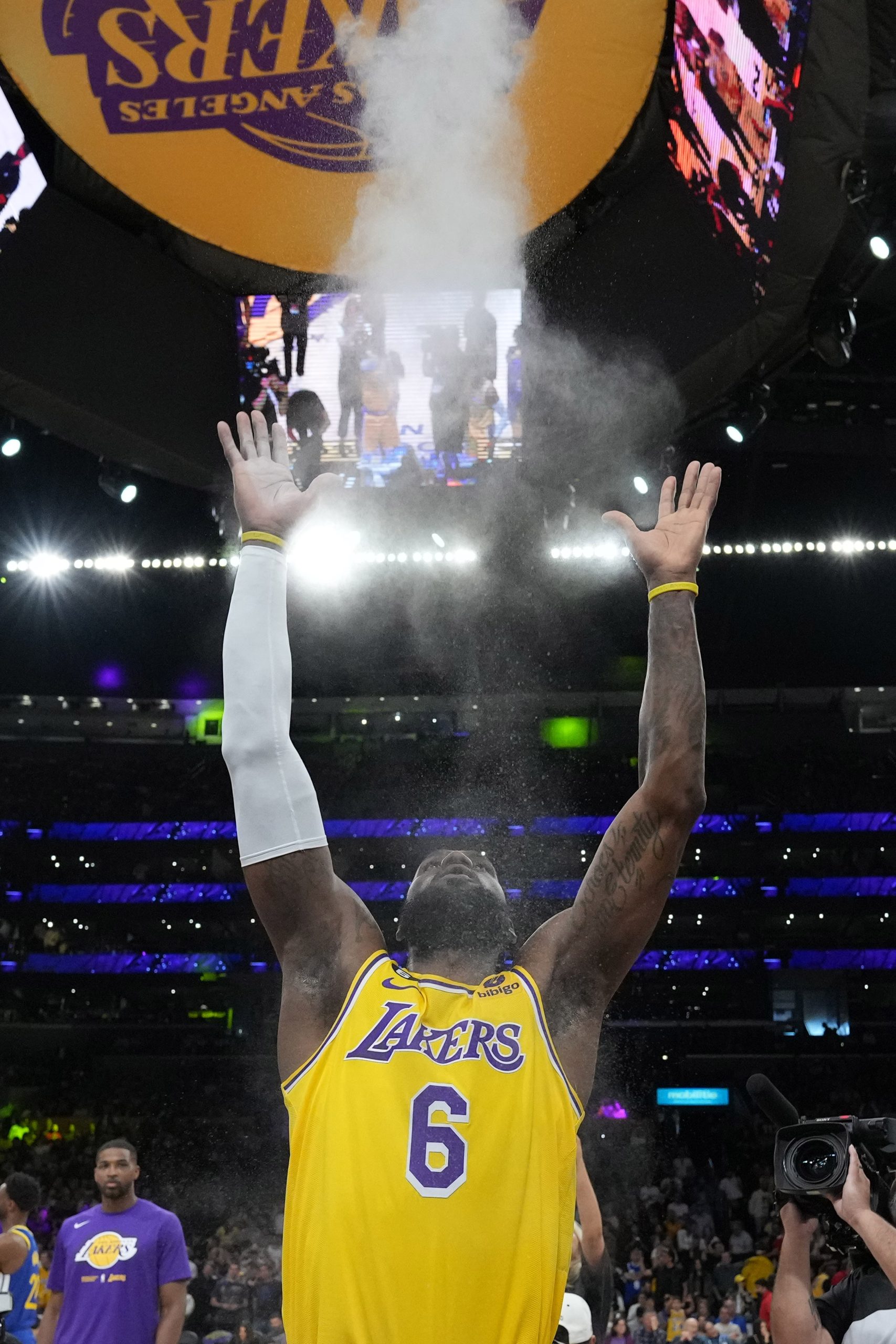 May 8, 2023; Los Angeles, California, USA; Los Angeles Lakers forward LeBron James (6) throws powdered chalk into the air during game four of the 2023 NBA playoffs at Crypto.com Arena. Mandatory Credit: Kirby Lee-USA TODAY Sports