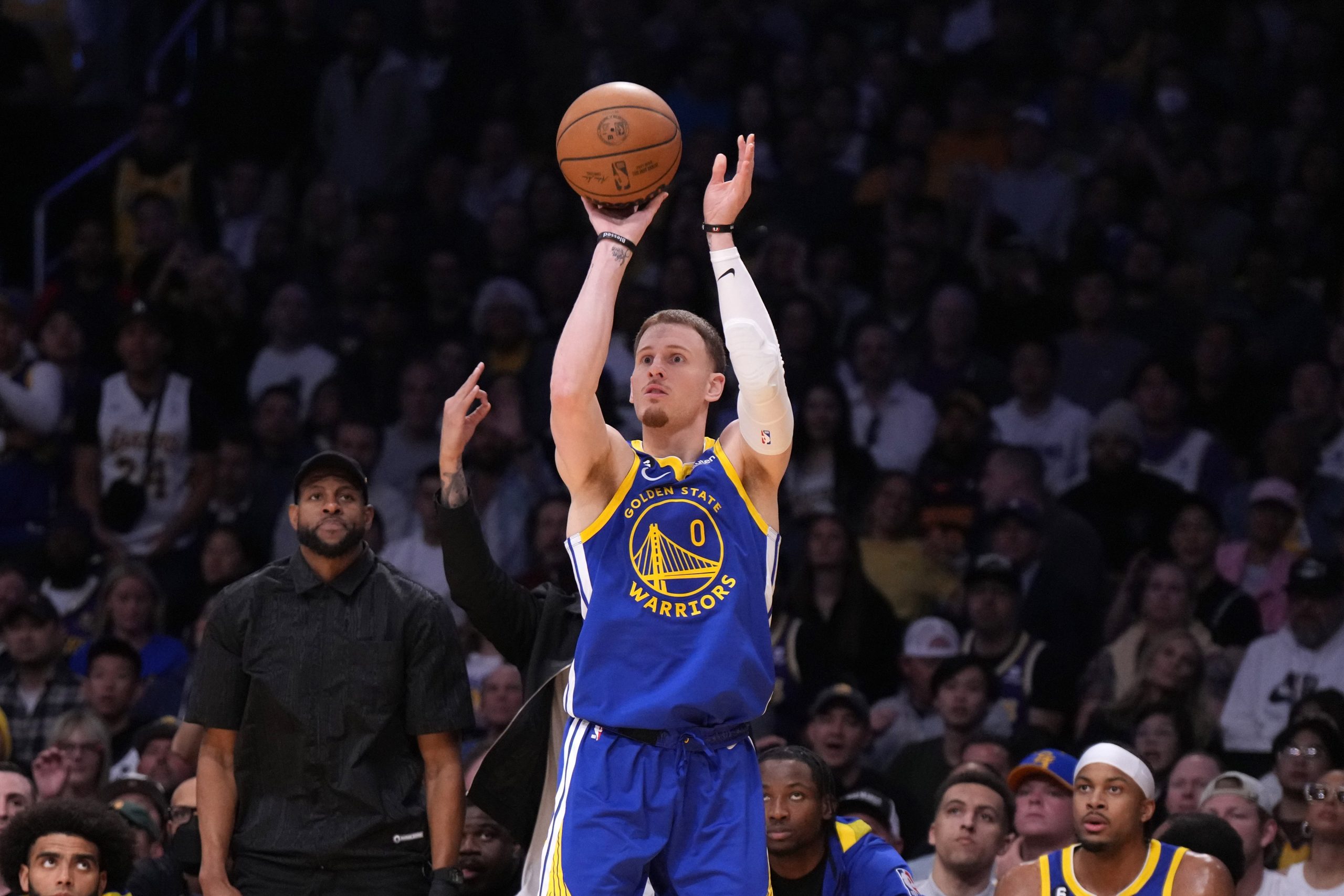May 8, 2023; Los Angeles, California, USA; Golden State Warriors guard Donte DiVincenzo (0) shoots the ball against the Los Angeles Lakers in the second half of game four of the 2023 NBA playoffs at Crypto.com Arena. Mandatory Credit: Kirby Lee-USA TODAY Sports