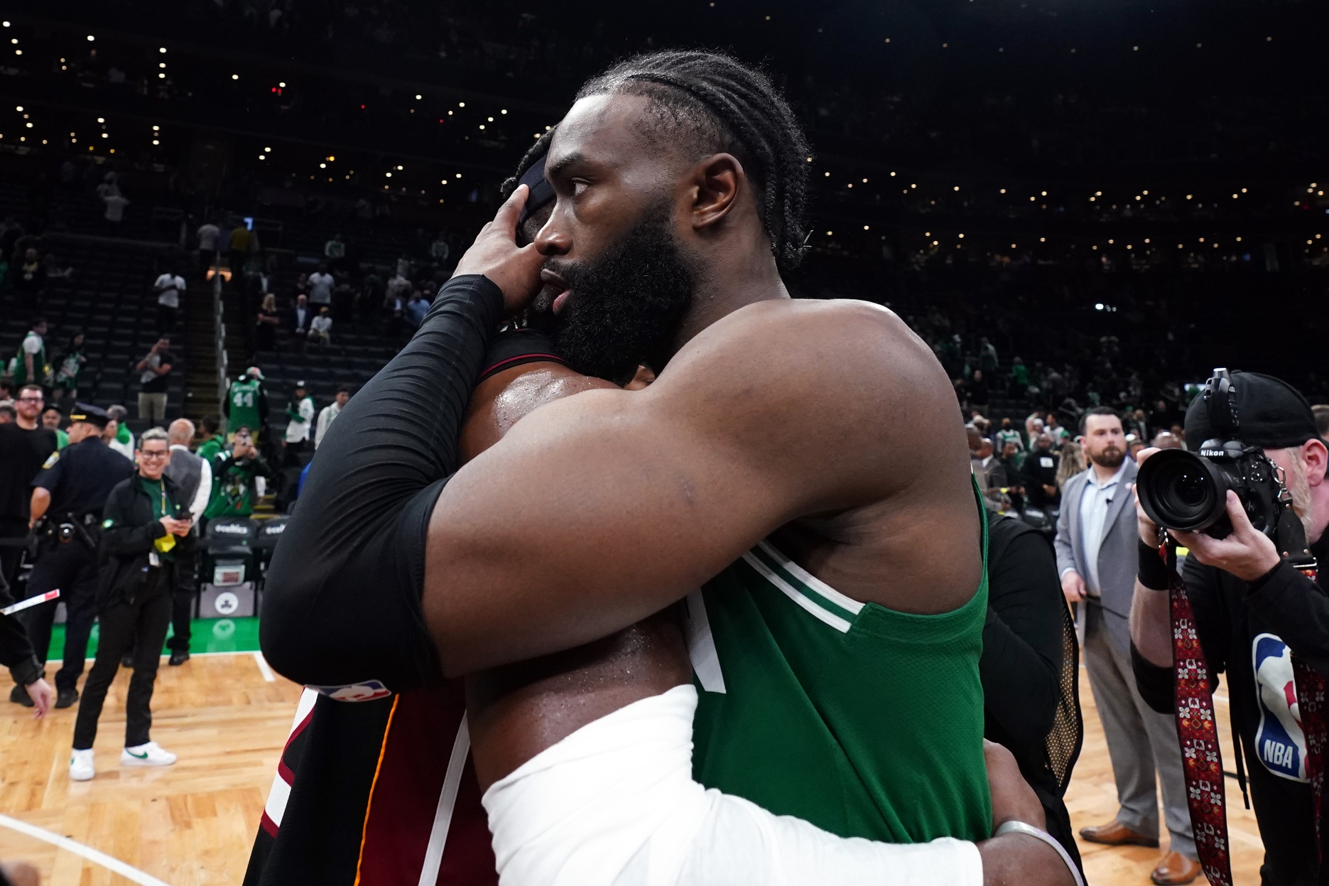 May 29, 2023; Boston, Massachusetts, USA; Miami Heat forward Jimmy Butler (22) embraces Boston Celtics guard Jaylen Brown (7) after the Heat defeated the Celtics in game seven of the Eastern Conference Finals for the 2023 NBA playoffs at TD Garden. Mandatory Credit: David Butler II-USA TODAY Sports