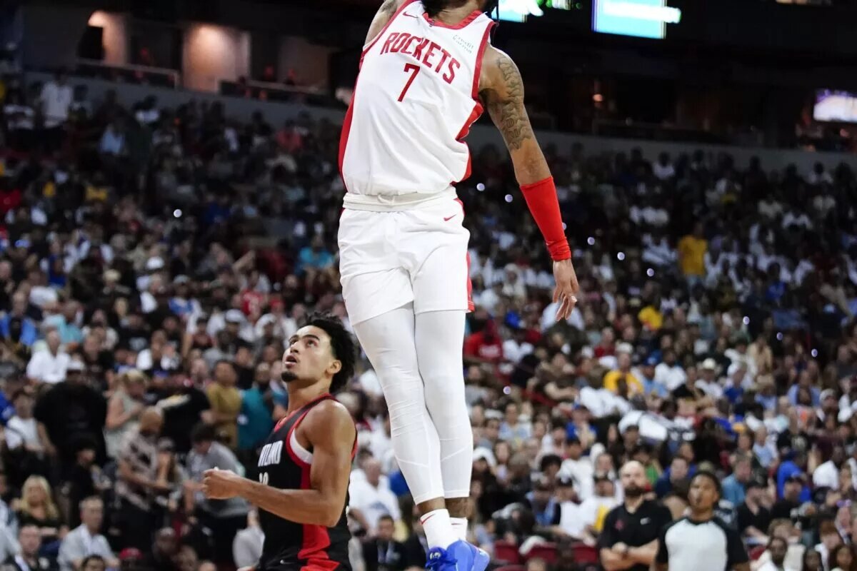 Jul 7, 2023; Las Vegas, NV, USA; Houston Rockets forward Cam Whitmore (7) dunks the ball against Portland Trail Blazers forward Justin Minaya (60) during the second half at Thomas & Mack Center. Mandatory Credit: Lucas Peltier-USA TODAY Sports