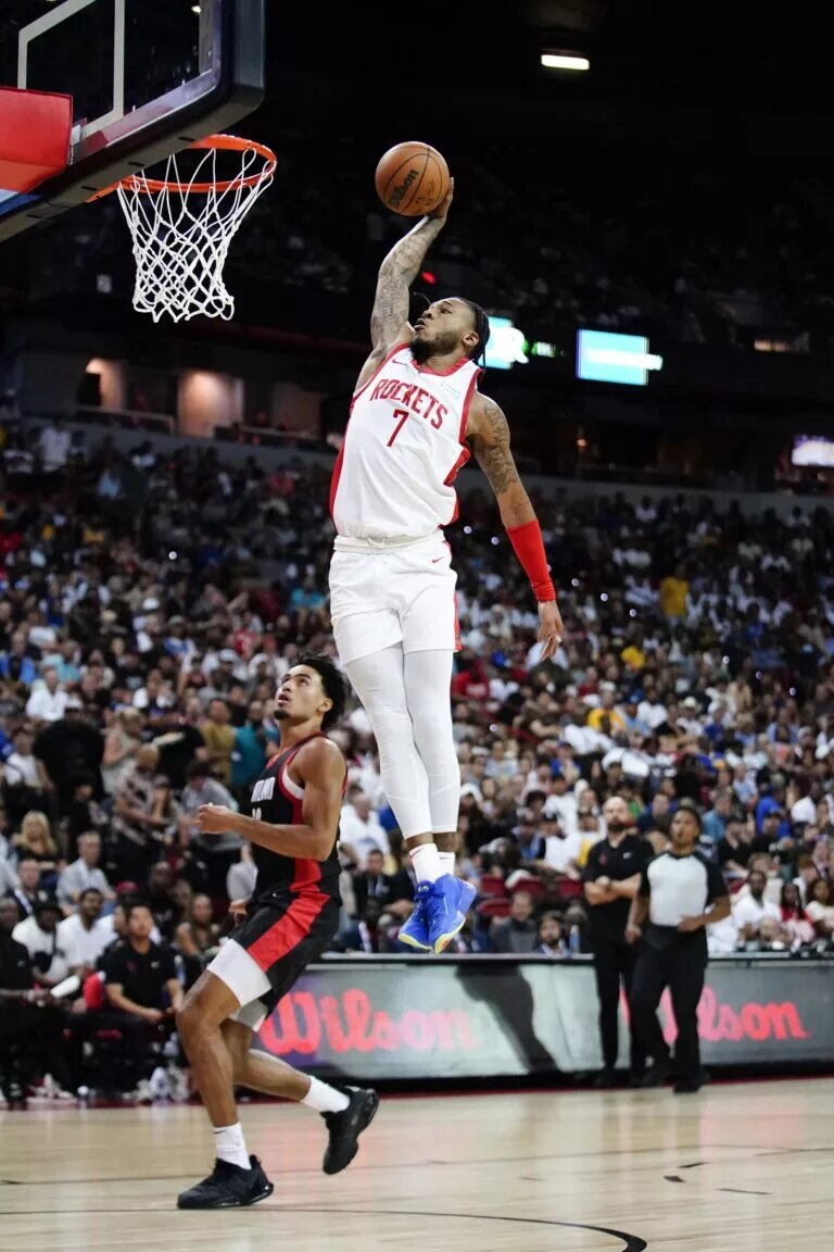 Jul 7, 2023; Las Vegas, NV, USA; Houston Rockets forward Cam Whitmore (7) dunks the ball against Portland Trail Blazers forward Justin Minaya (60) during the second half at Thomas & Mack Center. Mandatory Credit: Lucas Peltier-USA TODAY Sports