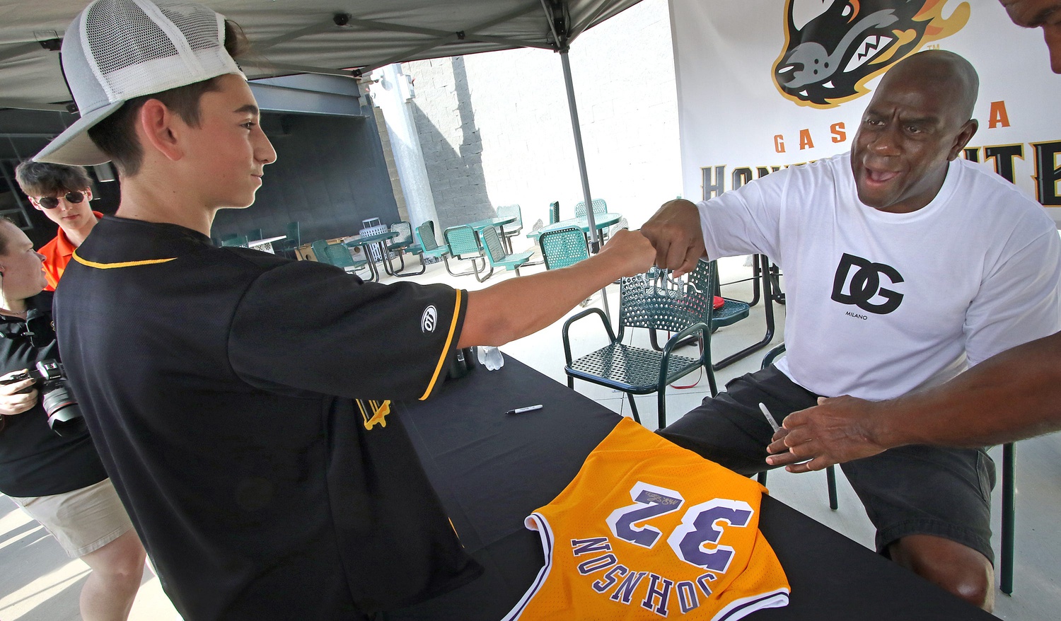 Sixteen-year-old Bryson Peoples has a jersey signed by Magic Johnson Friday afternoon, September 9, 2022, prior to the Honey Hunter’s game at CaroMont Health Park. Magic1b