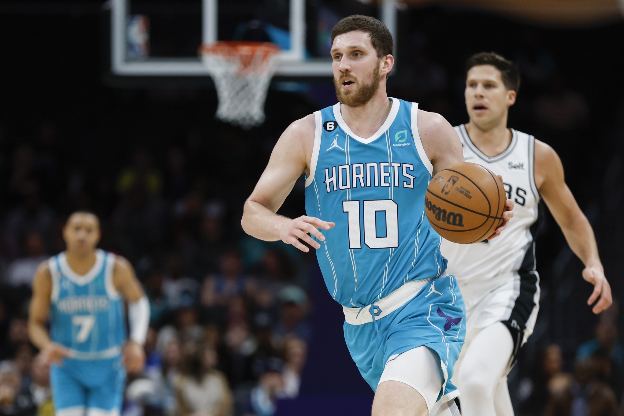 Feb 15, 2023; Charlotte, North Carolina, USA; Charlotte Hornets guard Svi Mykhailiuk (10) pushes the ball up court against the San Antonio Spurs during the second half at Spectrum Center. The Charlotte Hornets won 120-110. Mandatory Credit: Nell Redmond-USA TODAY Sports