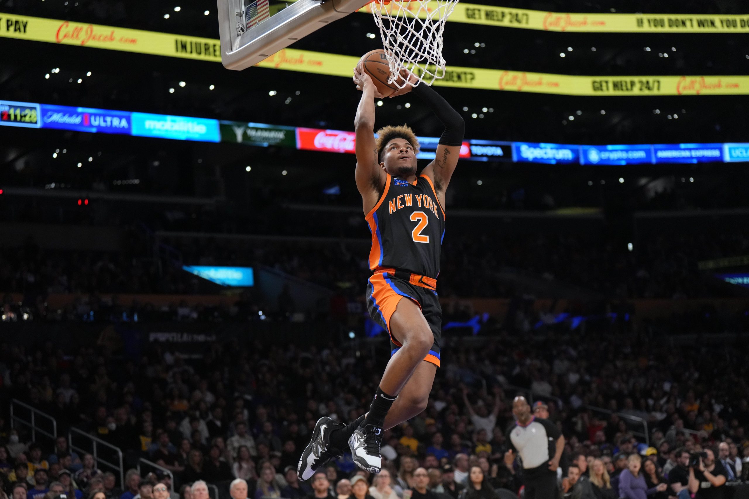 Mar 12, 2023; Los Angeles, California, USA; New York Knicks guard Miles McBride (2) dunks the ball against the Los Angeles Lakers in the first half at Crypto.com Arena. Mandatory Credit: Kirby Lee-USA TODAY Sports