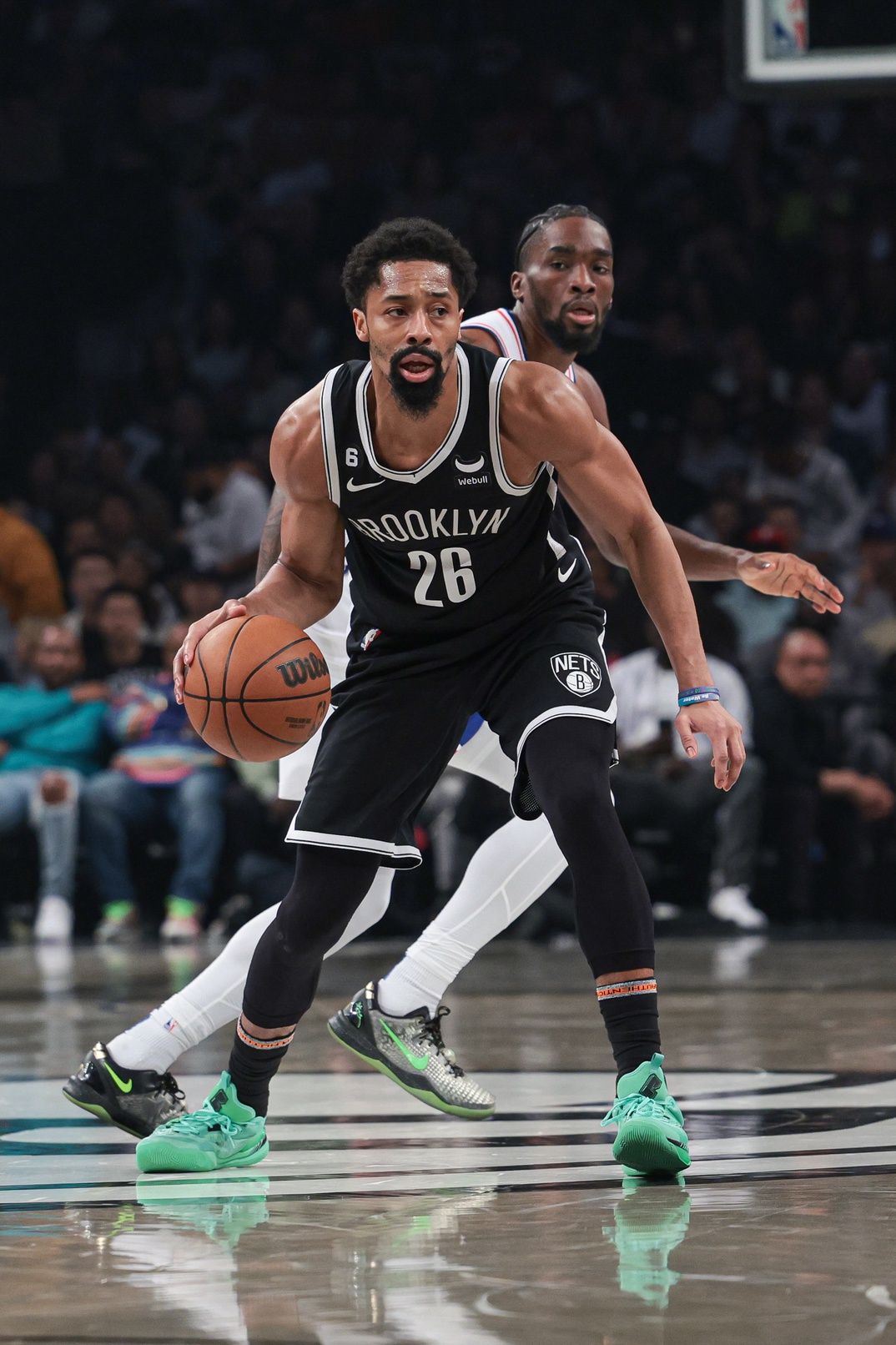 Apr 22, 2023; Brooklyn, New York, USA; Nets guard Spencer Dinwiddie (26) dribbles in front of Philadelphia 76ers guard Shake Milton (18) during the second quarter of game four of the 2023 NBA playoffs at Barclays Center. Mandatory Credit: Vincent Carchietta-USA TODAY Sports