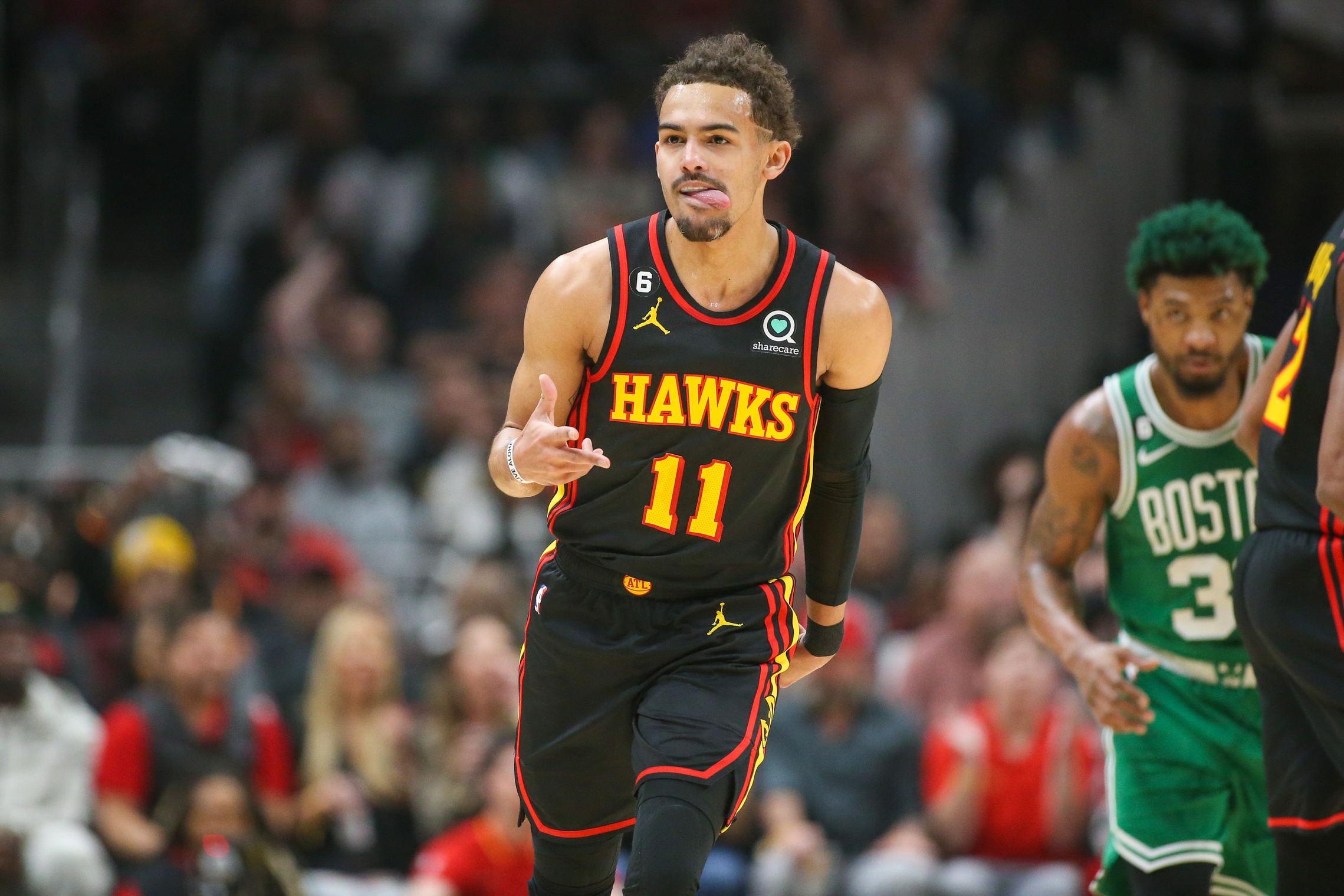 Apr 27, 2023; Atlanta, Georgia, USA; Atlanta Hawks guard Trae Young (11) reacts after a three-pointer against the Boston Celtics in the first quarter during game six of the 2023 NBA playoffs at State Farm Arena. Mandatory Credit: Brett Davis-USA TODAY Sports