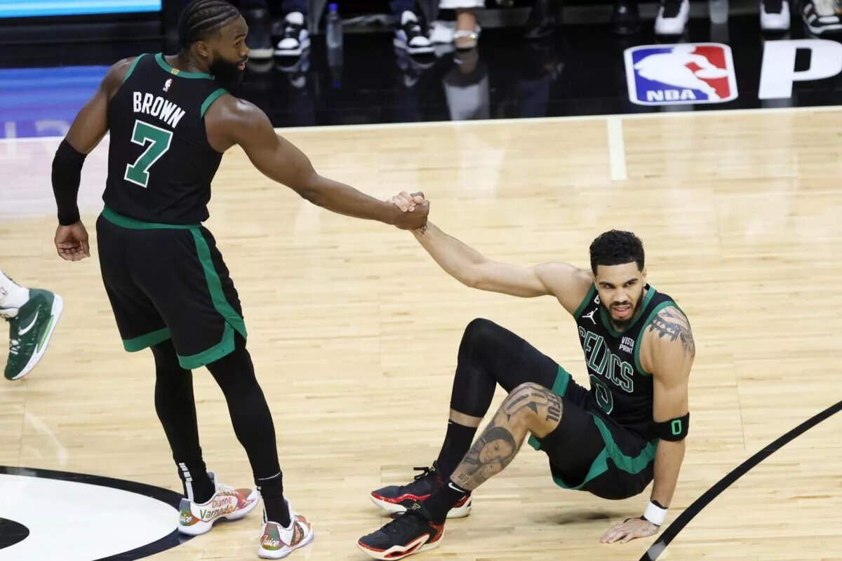 May 21, 2023; Miami, Florida, USA; Boston Celtics guard Jaylen Brown (7) helps up forward Jayson Tatum (0) during the first half against the Miami Heat in game three of the Eastern Conference Finals for the 2023 NBA playoffs at Kaseya Center. Mandatory Credit: Sam Navarro-USA TODAY Sports