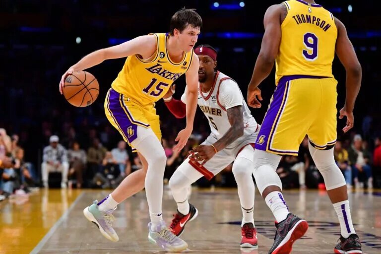 May 22, 2023; Los Angeles, California, USA; Los Angeles Lakers guard Austin Reaves (15) fights for position agianst Denver Nuggets guard Kentavious Caldwell-Pope (5) during the third quarter in game four of the Western Conference Finals for the 2023 NBA playoffs at Crypto.com Arena. Mandatory Credit: Gary A. Vasquez-USA TODAY Sports